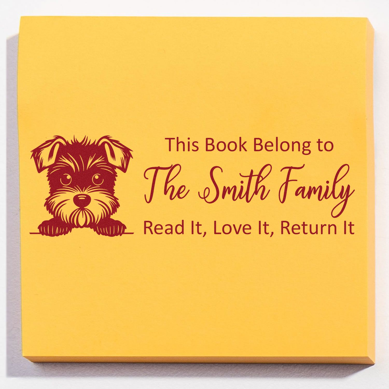 Custom rubber stamp for books with dog design: This Book Belongs to The Smith Family return-to-owner library stamp.
