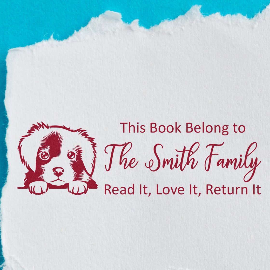Personalized rubber book stamp with puppy graphic and The Smith Family return message for books.
