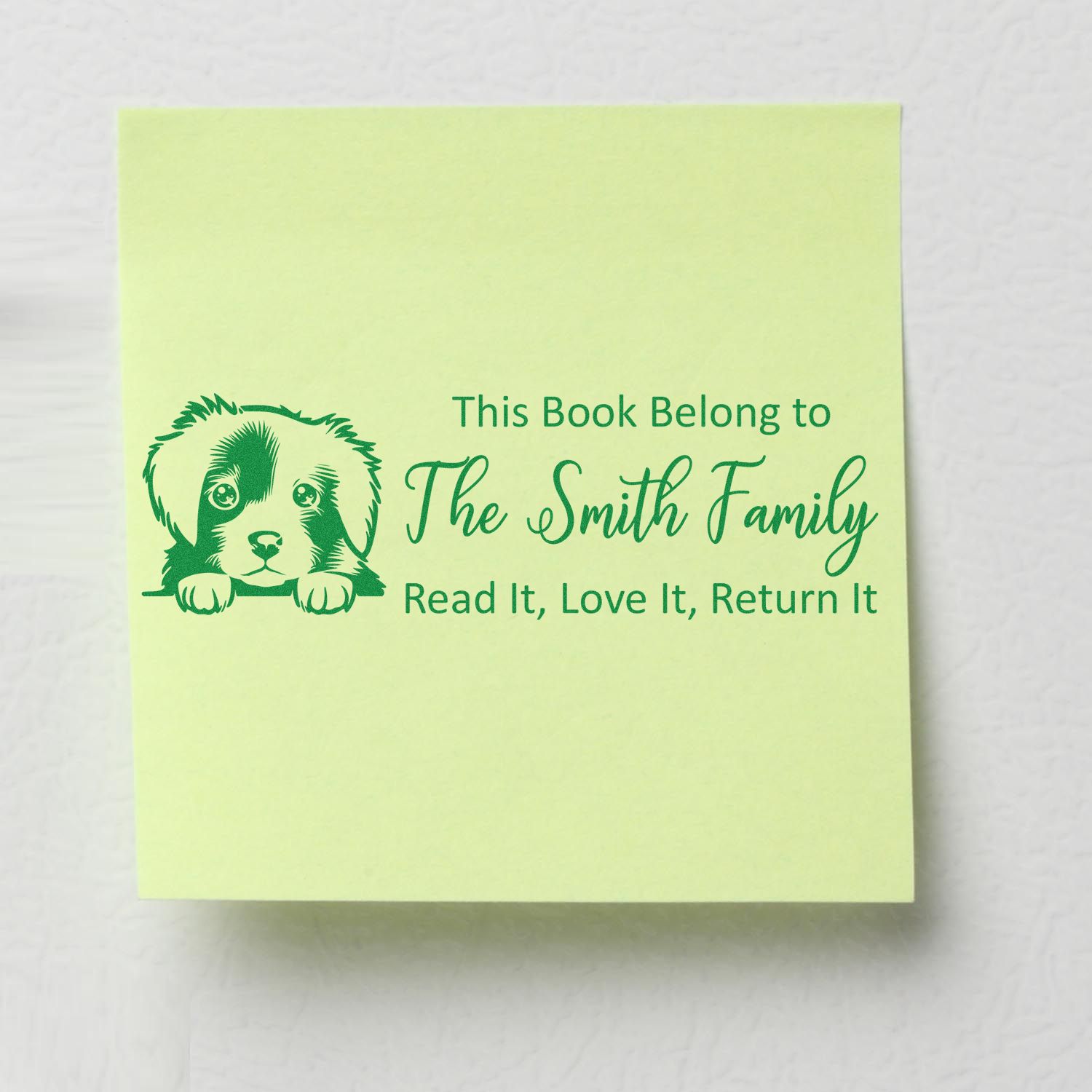 Custom rubber bookplate stamp with puppy graphic and Read It, Love It, Return It for The Smith Family.