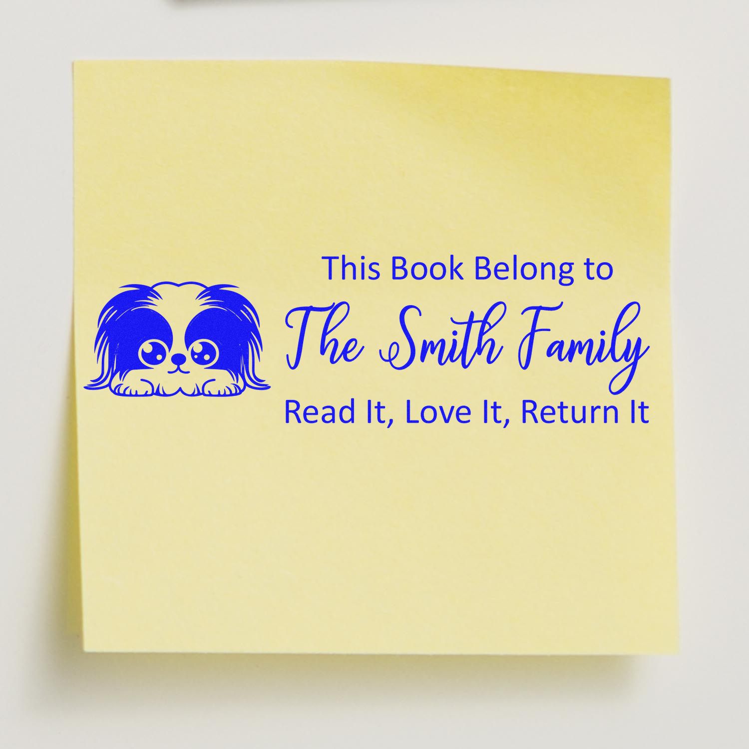 Personalized dog book stamp for family library books with This Book Belong to The Smith Family and return notice.