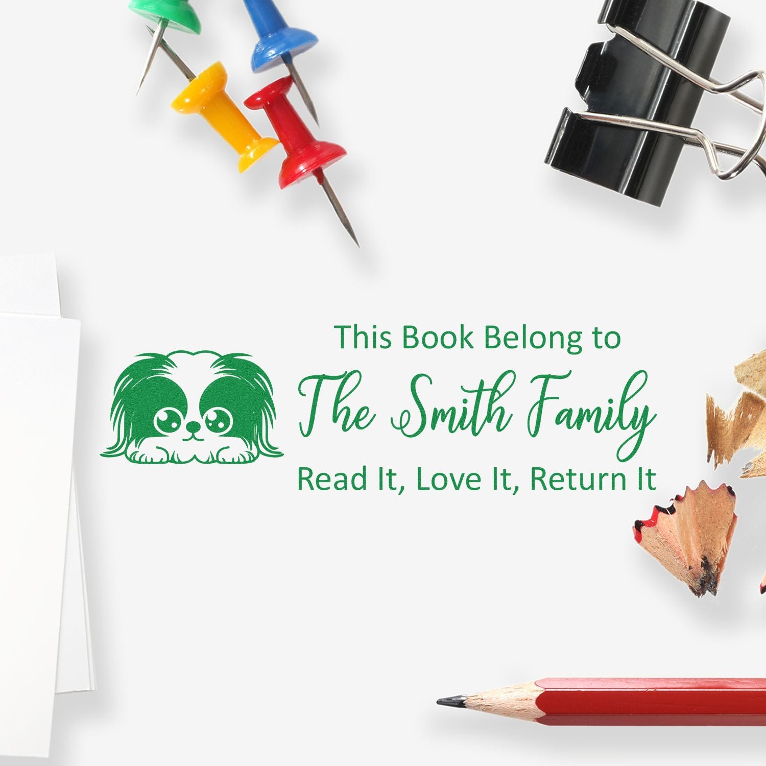 Personalized rubber book stamp with dog icon and family name: This Book Belongs to The Smith Family, Read It, Love It, Return It.