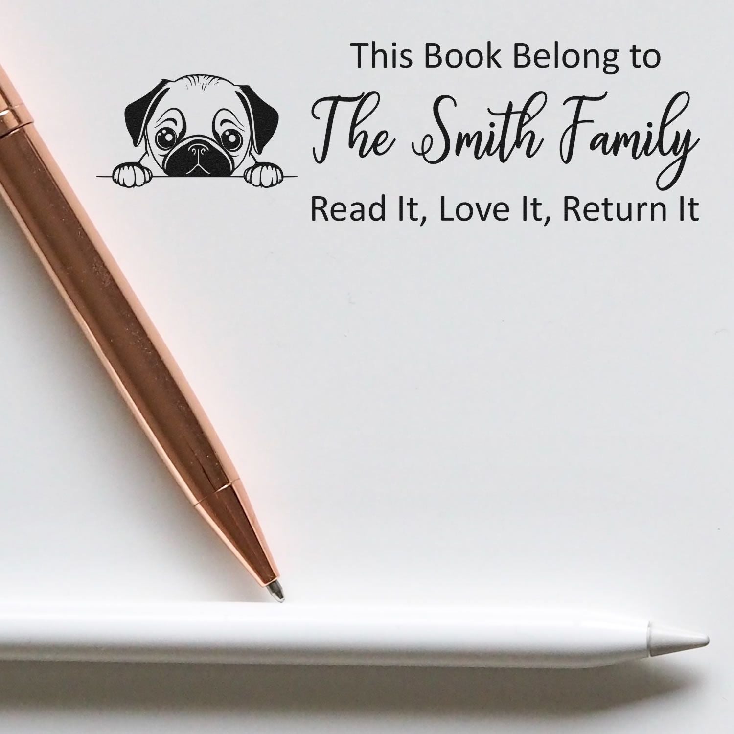 Custom rubber book stamp for The Smith Family with pug artwork and Read It, Love It, Return It ownership message.