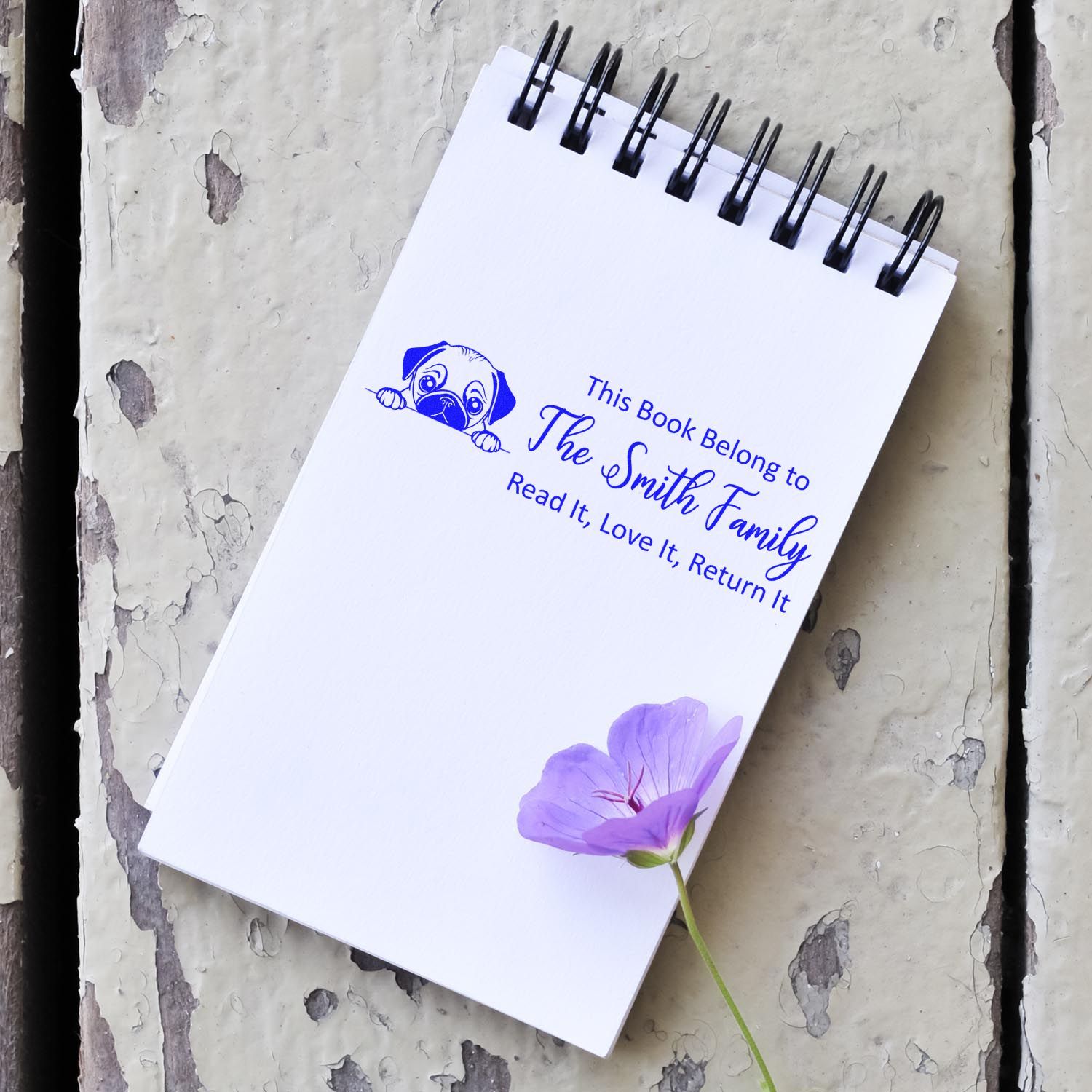 Personalized rubber stamp for books, showing the Smith familys Read It, Love It, Return It bookplate with dog icon.