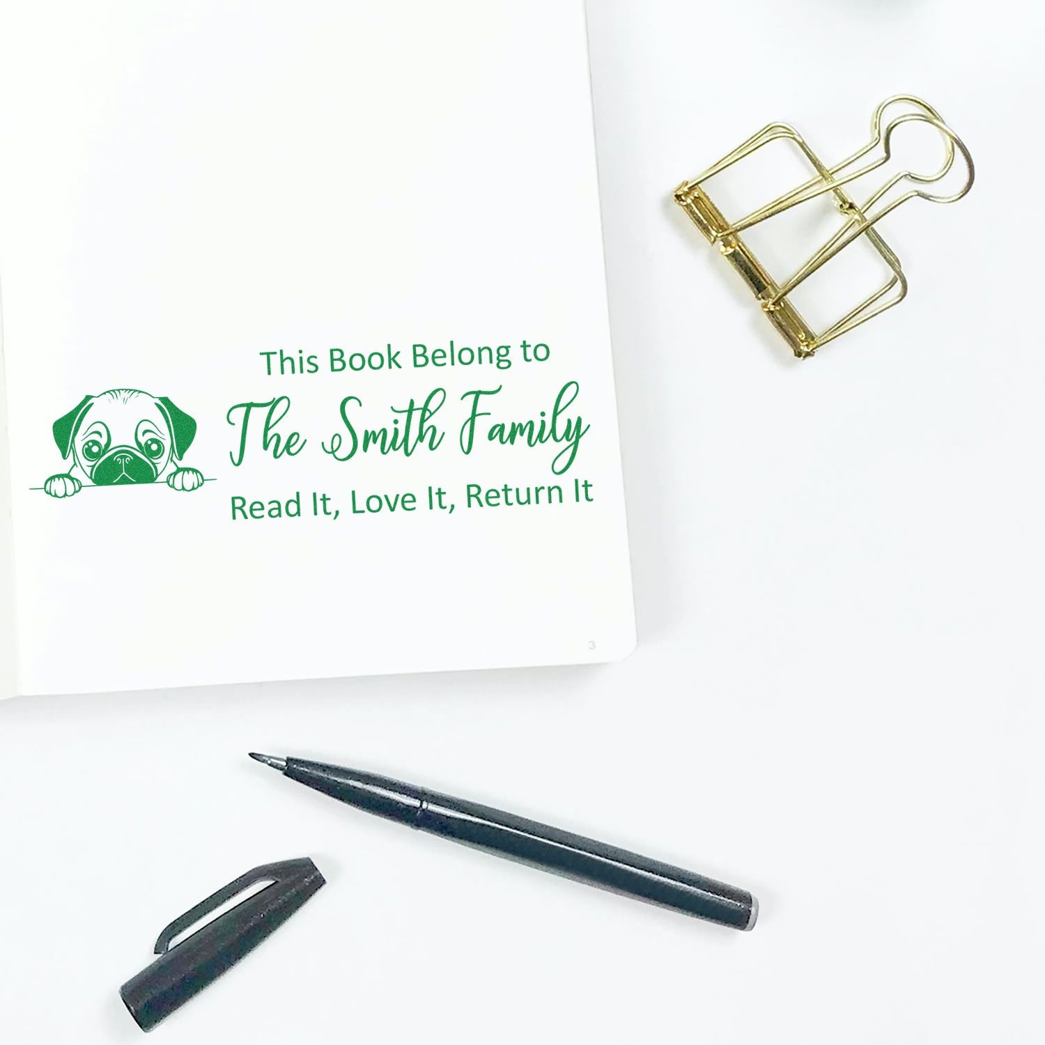 Personalized rubber book stamp for The Smith Family, featuring a dog design and Read It, Love It, Return It bookplate.