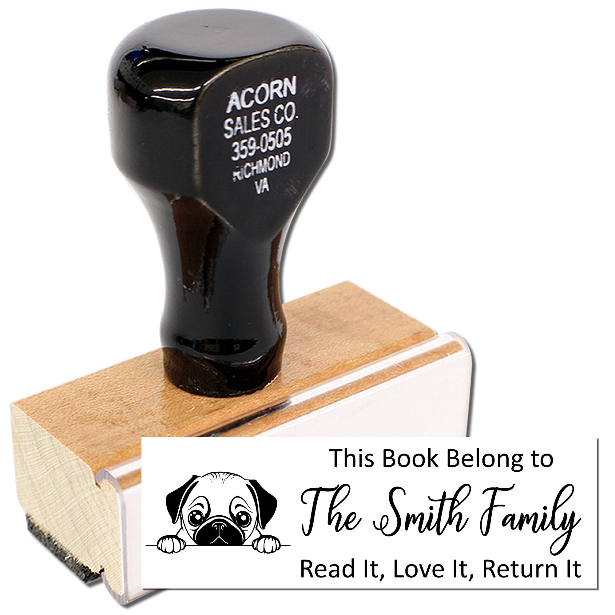 Personalized book ownership rubber stamp with dog graphic, used to label family library books.