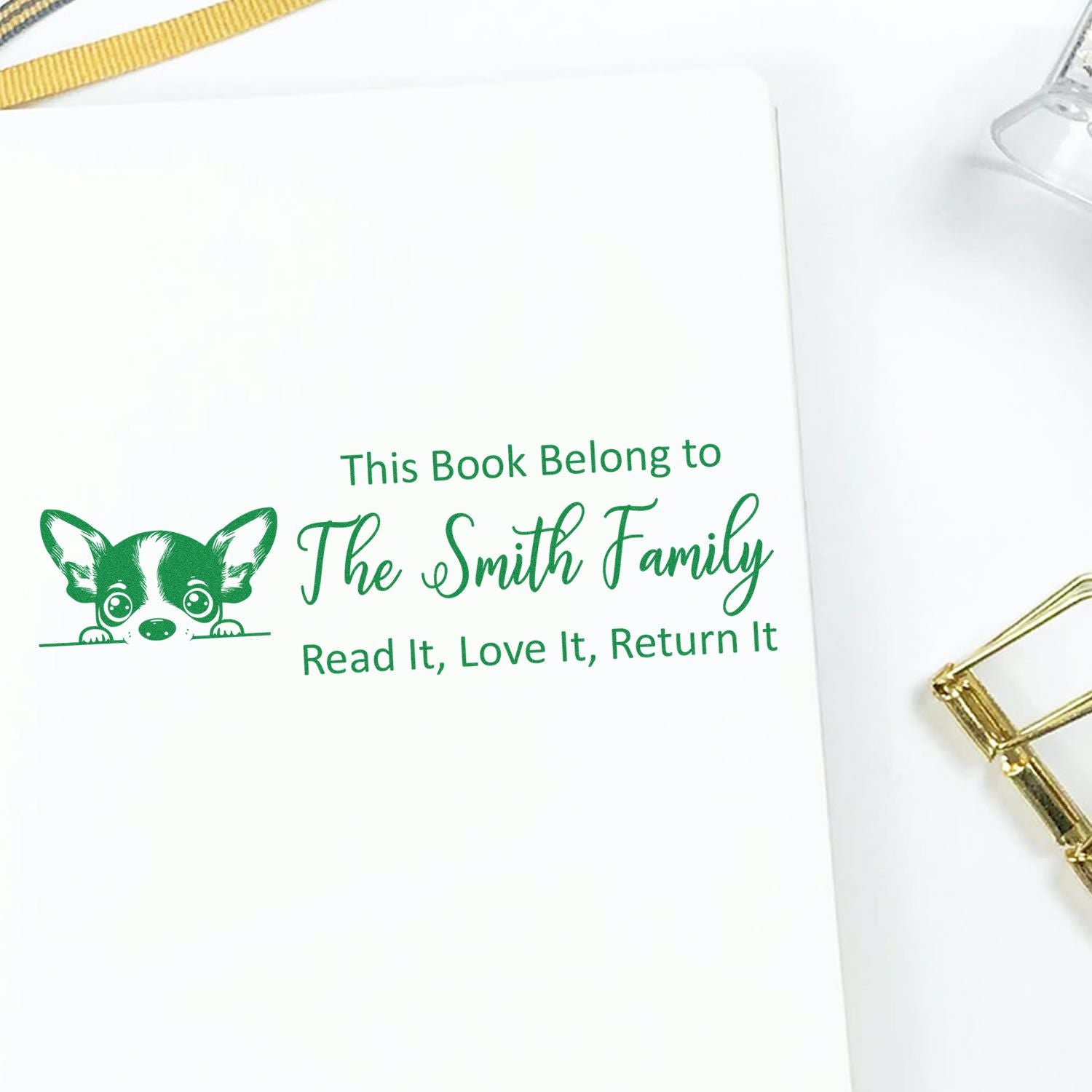 Personalized book stamp with dog design for The Smith Family, a custom rubber stamp that says Read It, Love It, Return It.