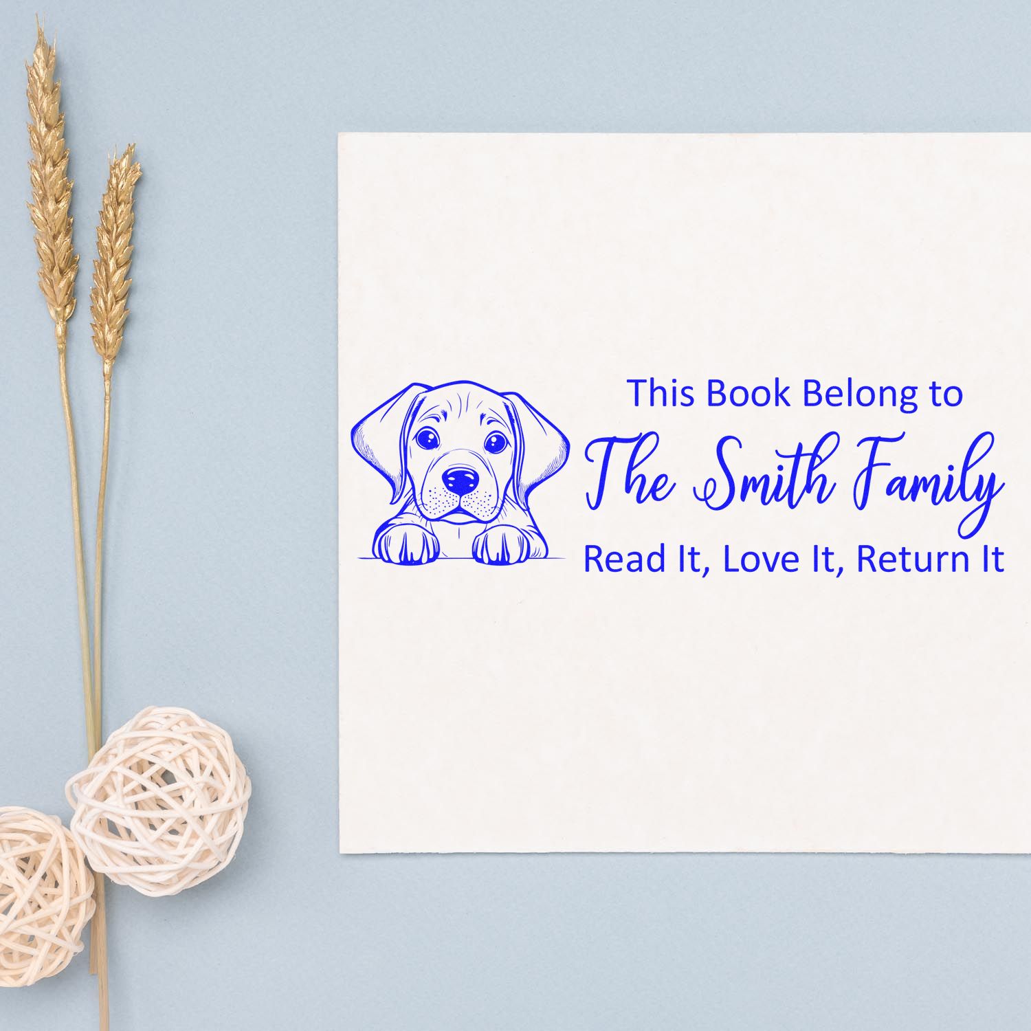 Personalized dog book stamp for The Smith Family, labeled: This Book Belong to... Read It, Love It, Return It.