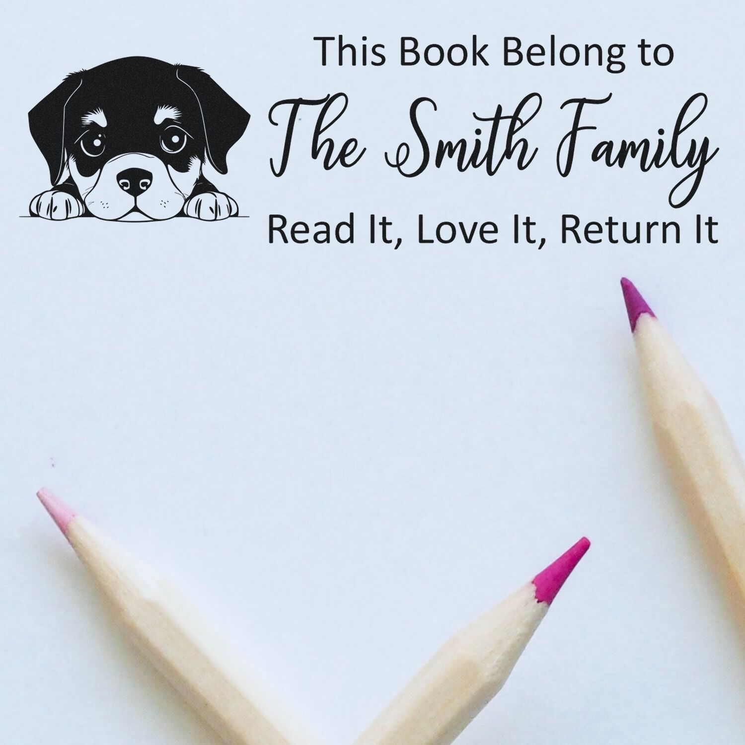 Personalized rubber book stamp with puppy graphic: This Book Belongs to The Smith Family, Read It, Love It, Return It.