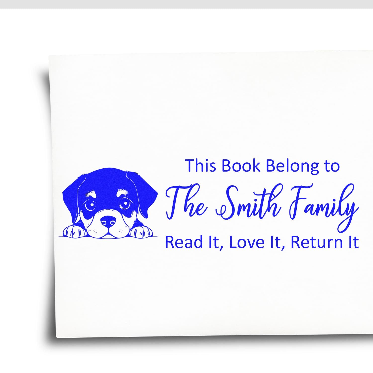 Custom rubber book stamp with puppy icon and Smith family name: This book belongs to The Smith Family, Read it, Love it, Return it.