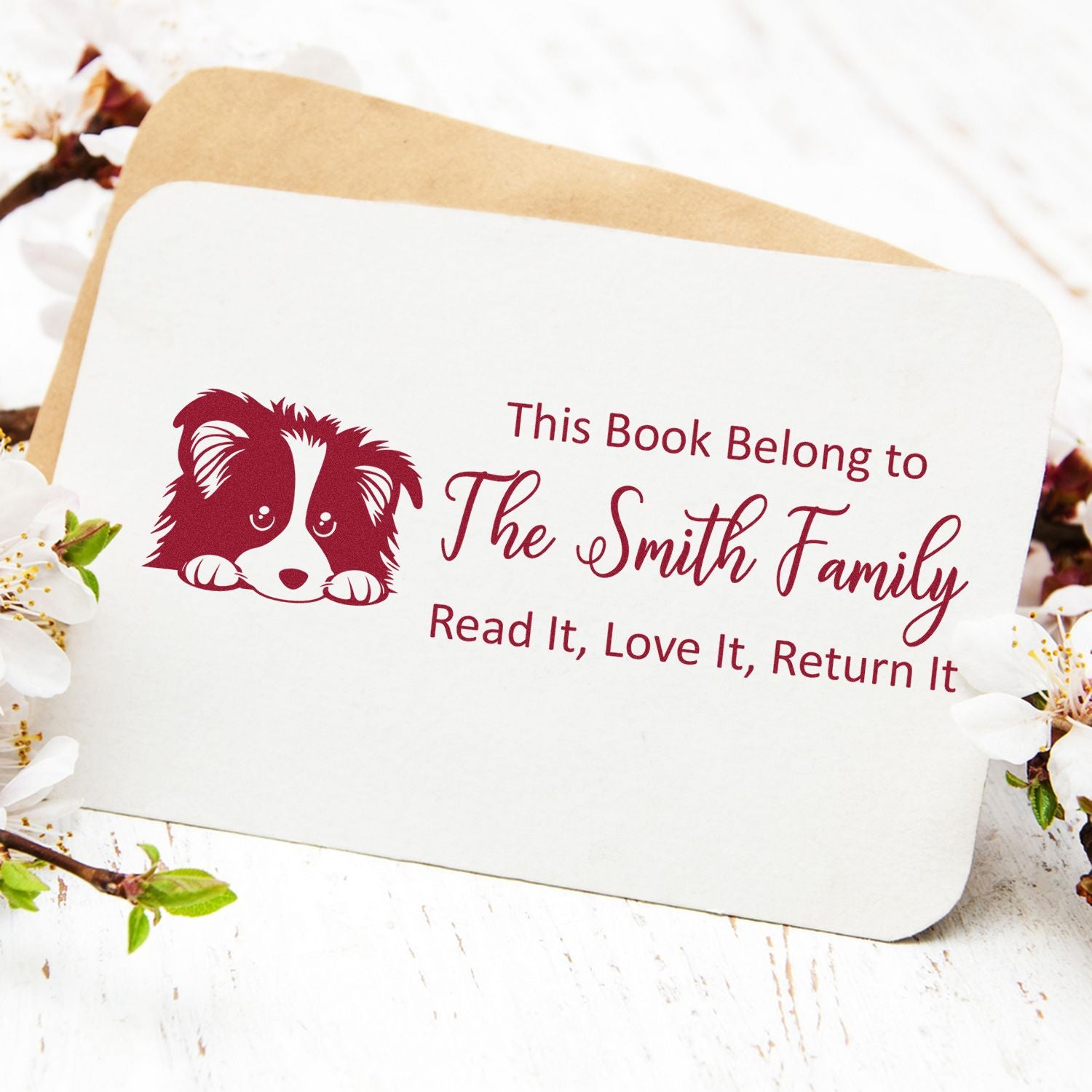 Custom rubber book stamp with dog illustration: This Book Belongs to The Smith Family, Read It, Love It, Return It.