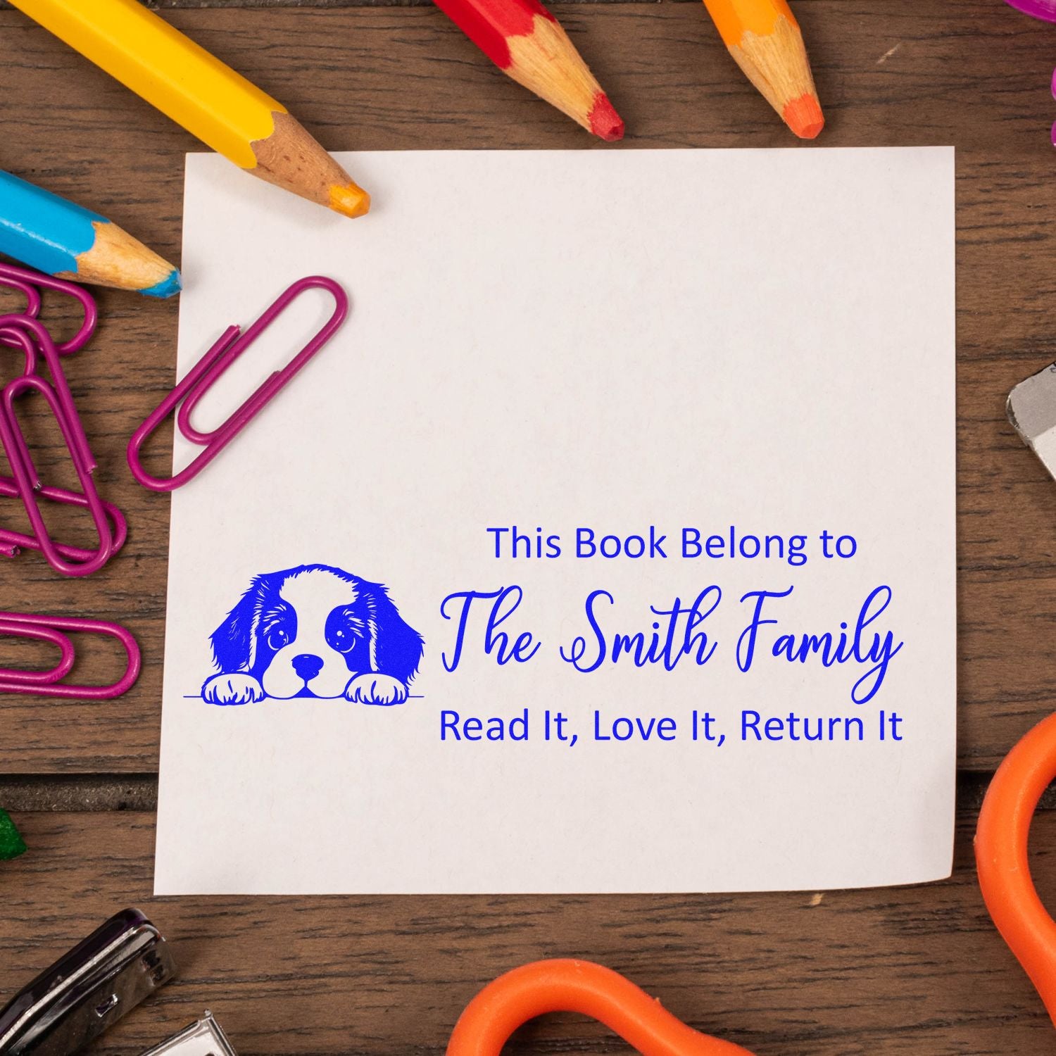 Custom rubber stamp bookplate with dog illustration for The Smith Family: Read It, Love It, Return It.