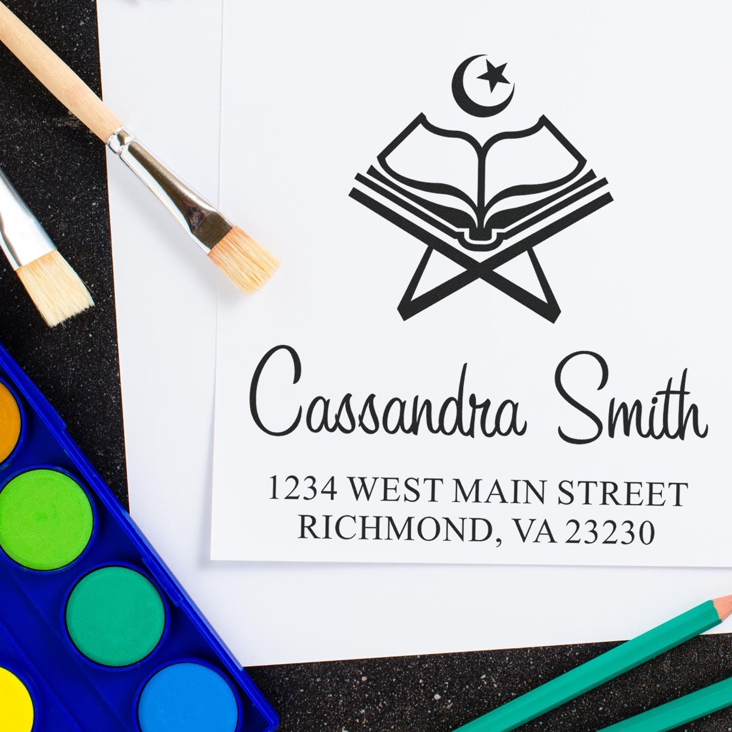 Custom rubber stamp design for a personalized address stamp with name, address, and crescent book logo.