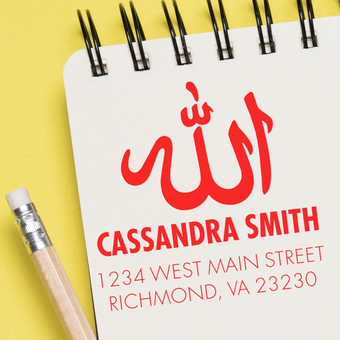 Personalized rubber address stamp with Arabic calligraphy, name, and Richmond, VA address in red ink on notebook paper.
