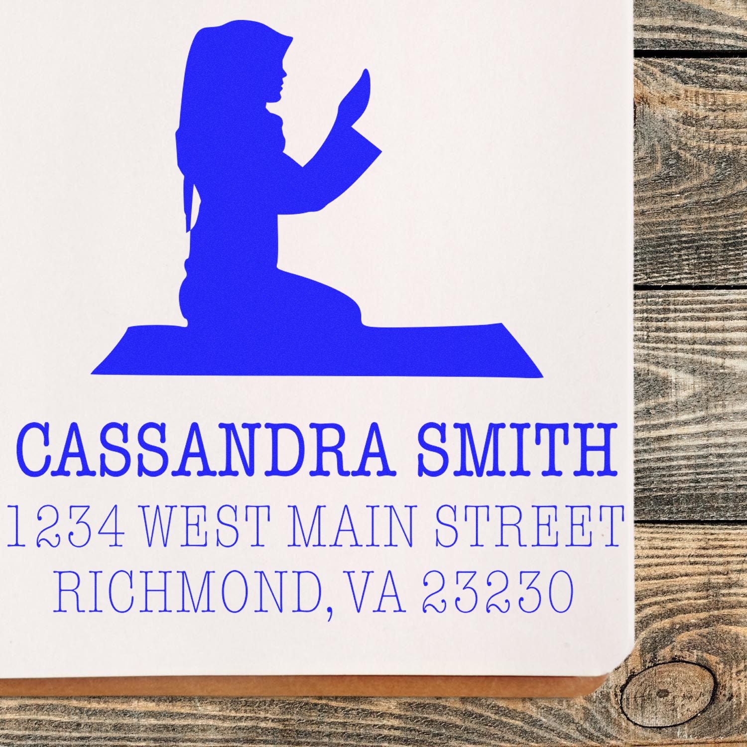 Custom return address rubber stamp with blue silhouette, personalized for Cassandra Smith, Richmond, VA.