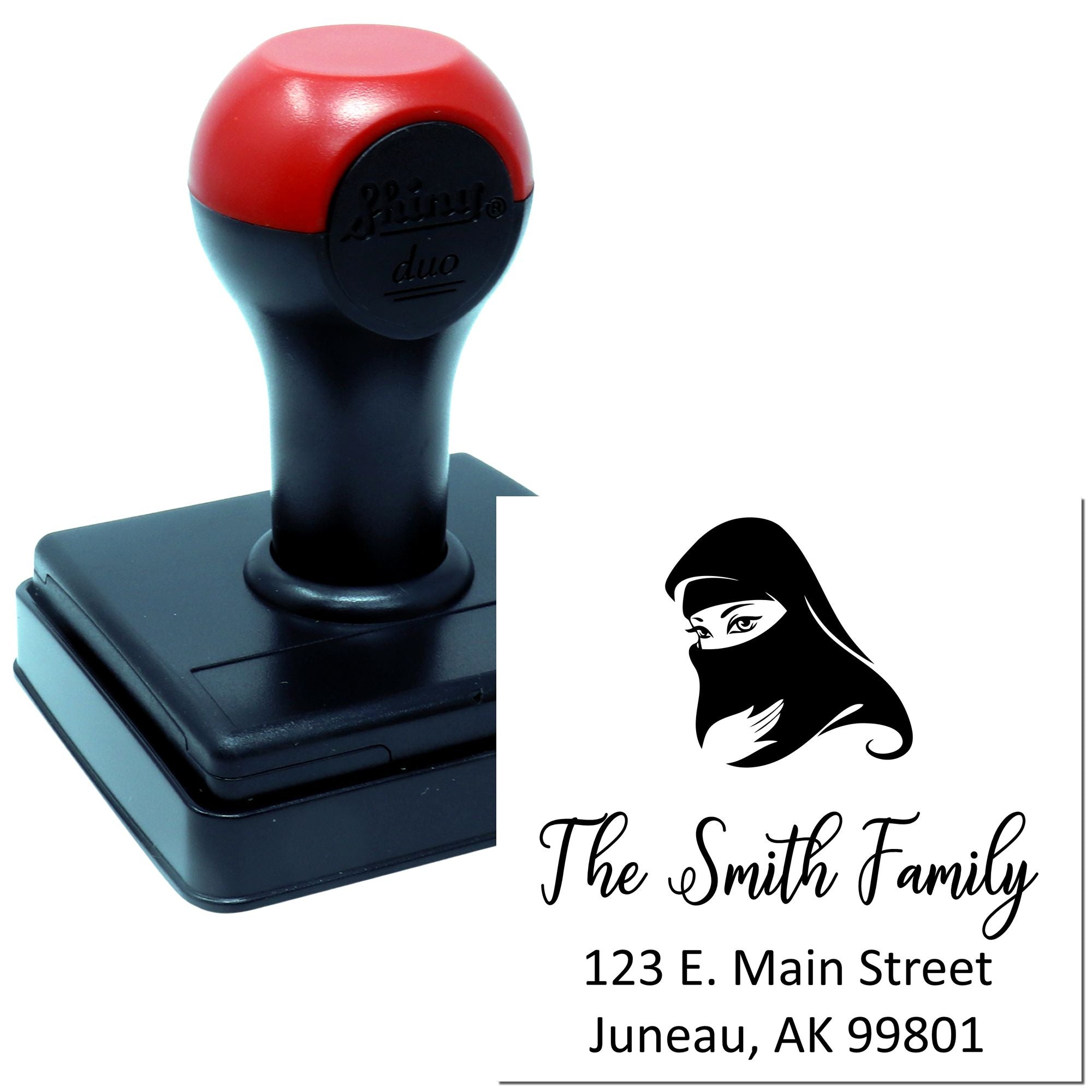 Self-inking rubber address stamp for The Smith Family with hijab icon and return address in Juneau, AK.