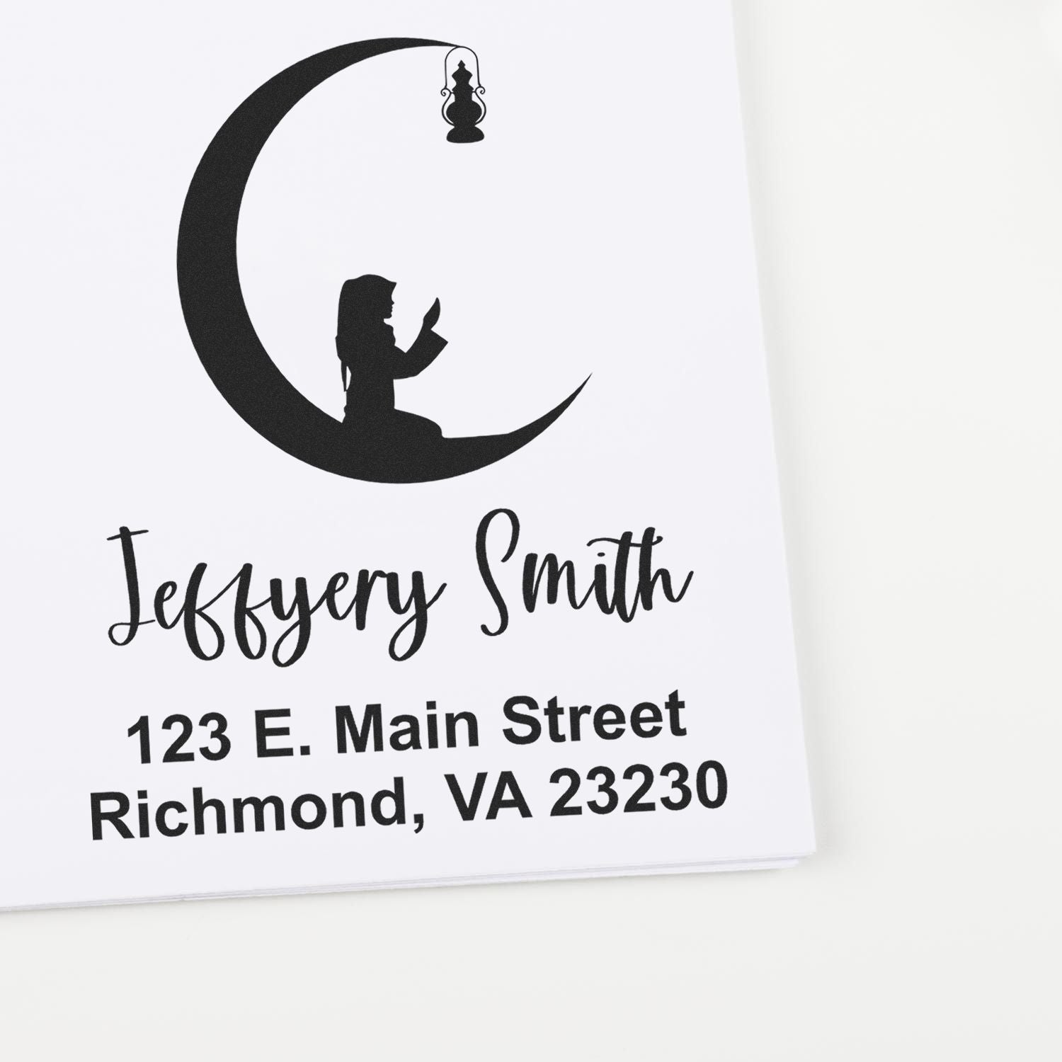 Custom rubber address stamp for Jeffrey Smith, 123 E. Main Street, Richmond, VA 23230, with moon and lantern design.