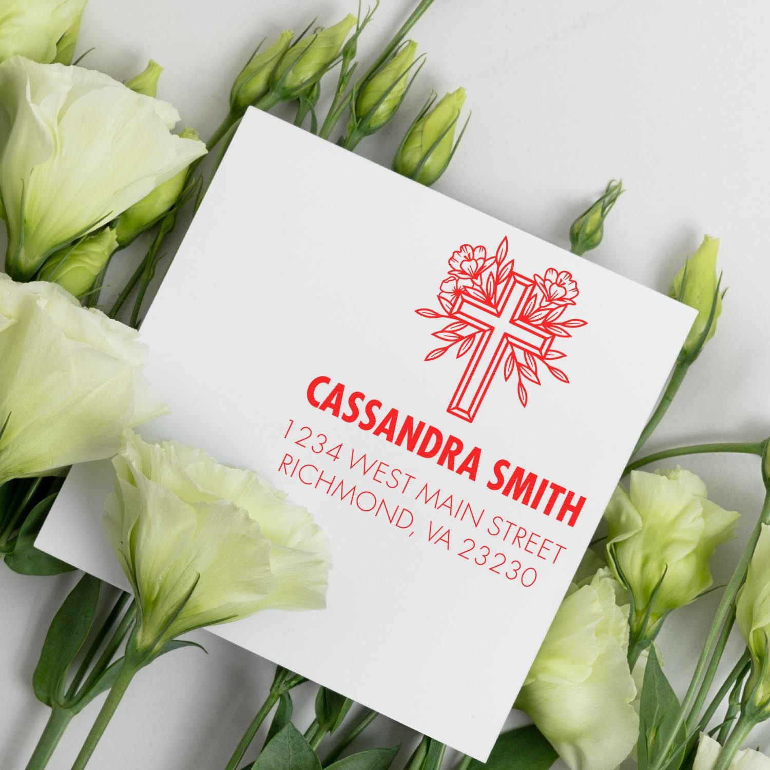 Personalized rubber stamp with floral cross design and return address for Cassandra Smith