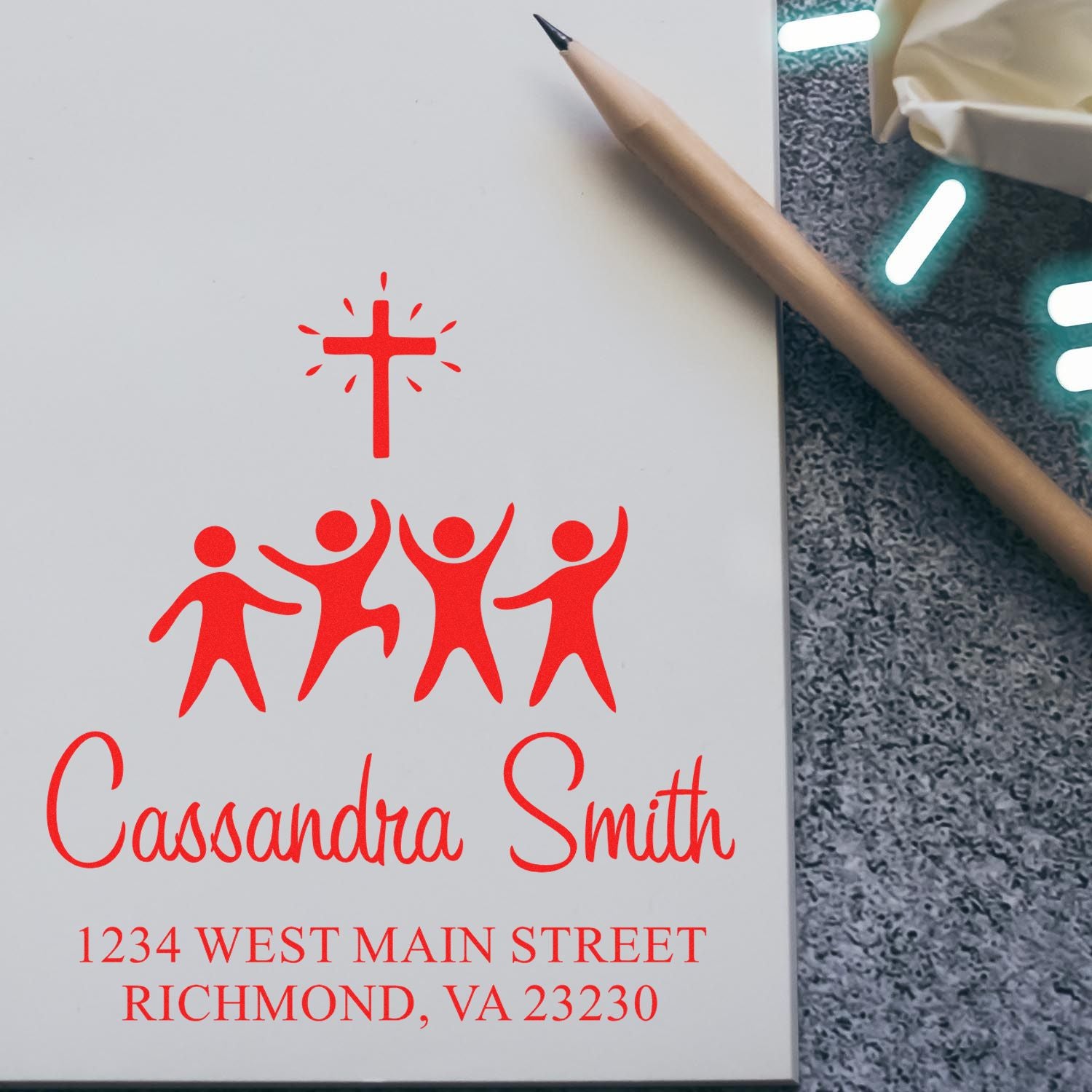 Personalized church rubber stamp design with cross, people icon, name, and address for mailing or outreach.