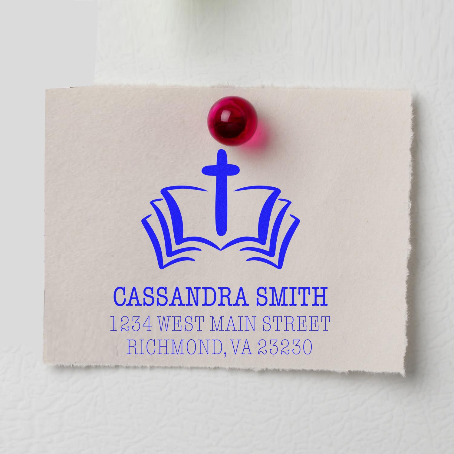 Personalized return address rubber stamp with cross and book logo for Cassandra Smith, Richmond VA.