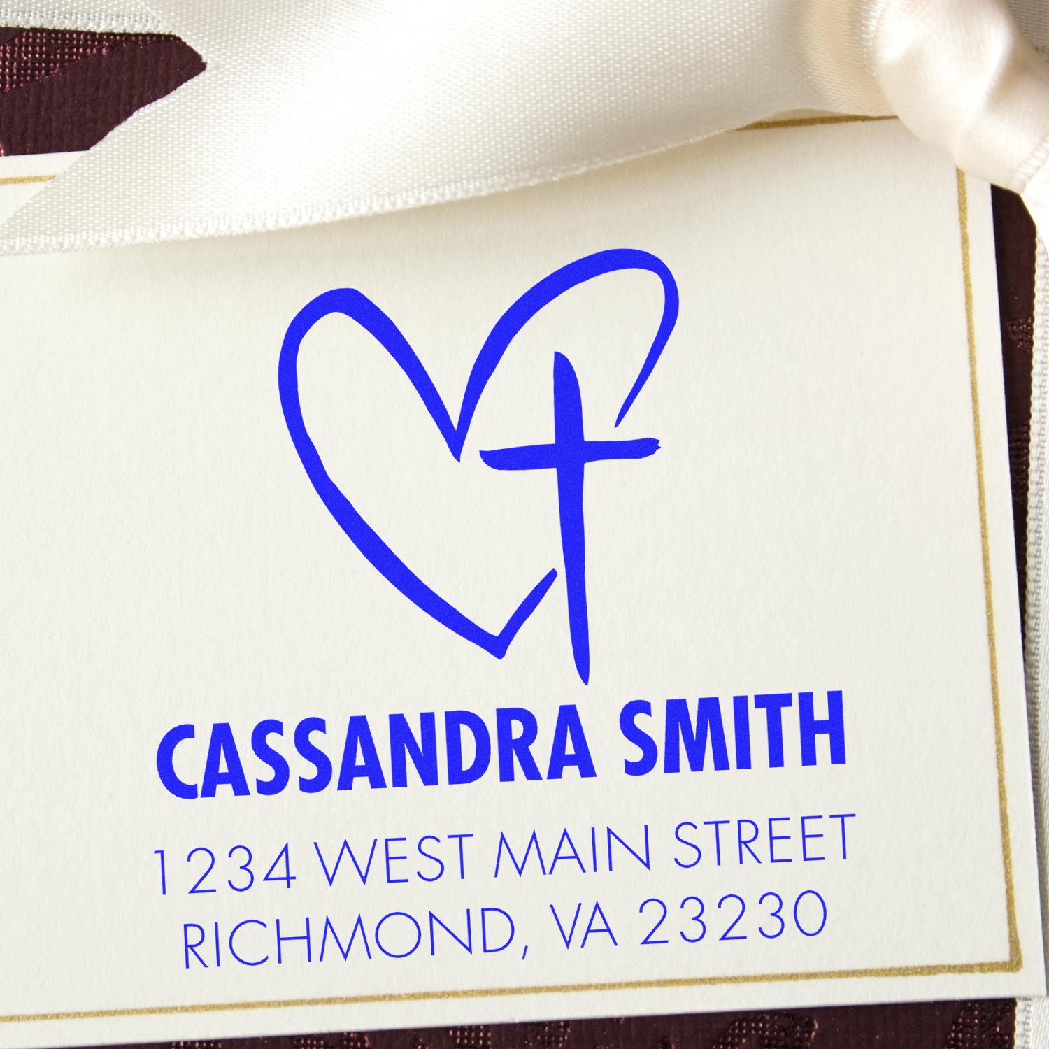 Personalized return address rubber stamp with heart and cross design for Cassandra Smith, Richmond VA.