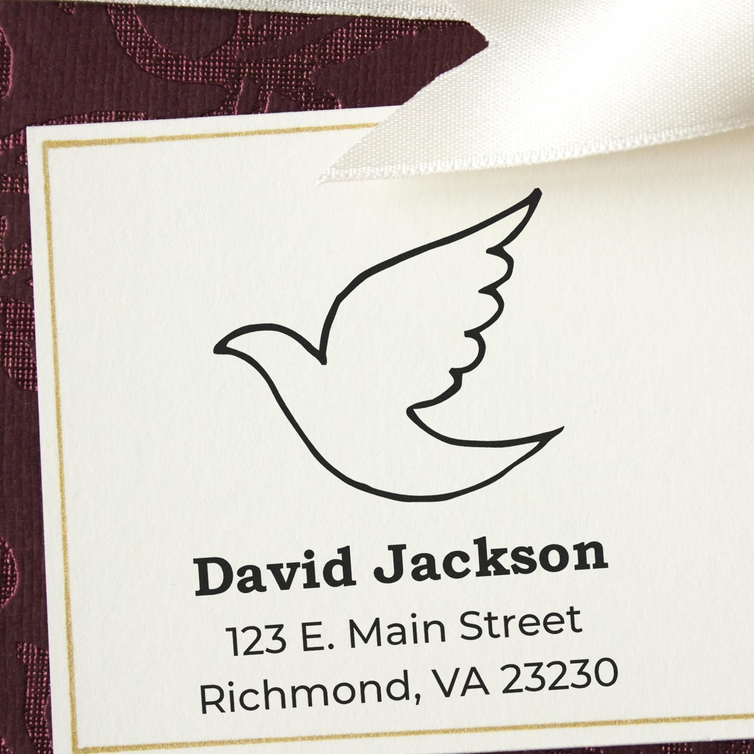 Custom rubber stamp with dove logo and return address for David Jackson, Richmond, VA