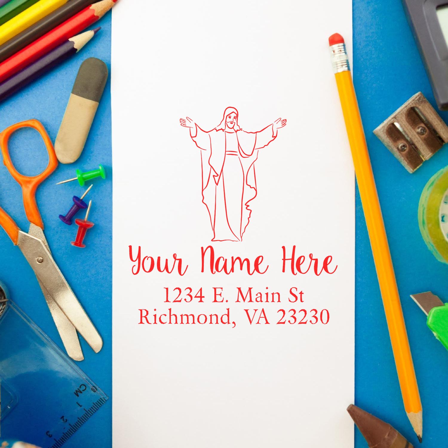 Custom Christian rubber stamp mockup with Jesus design, personalized name, and return address on paper.