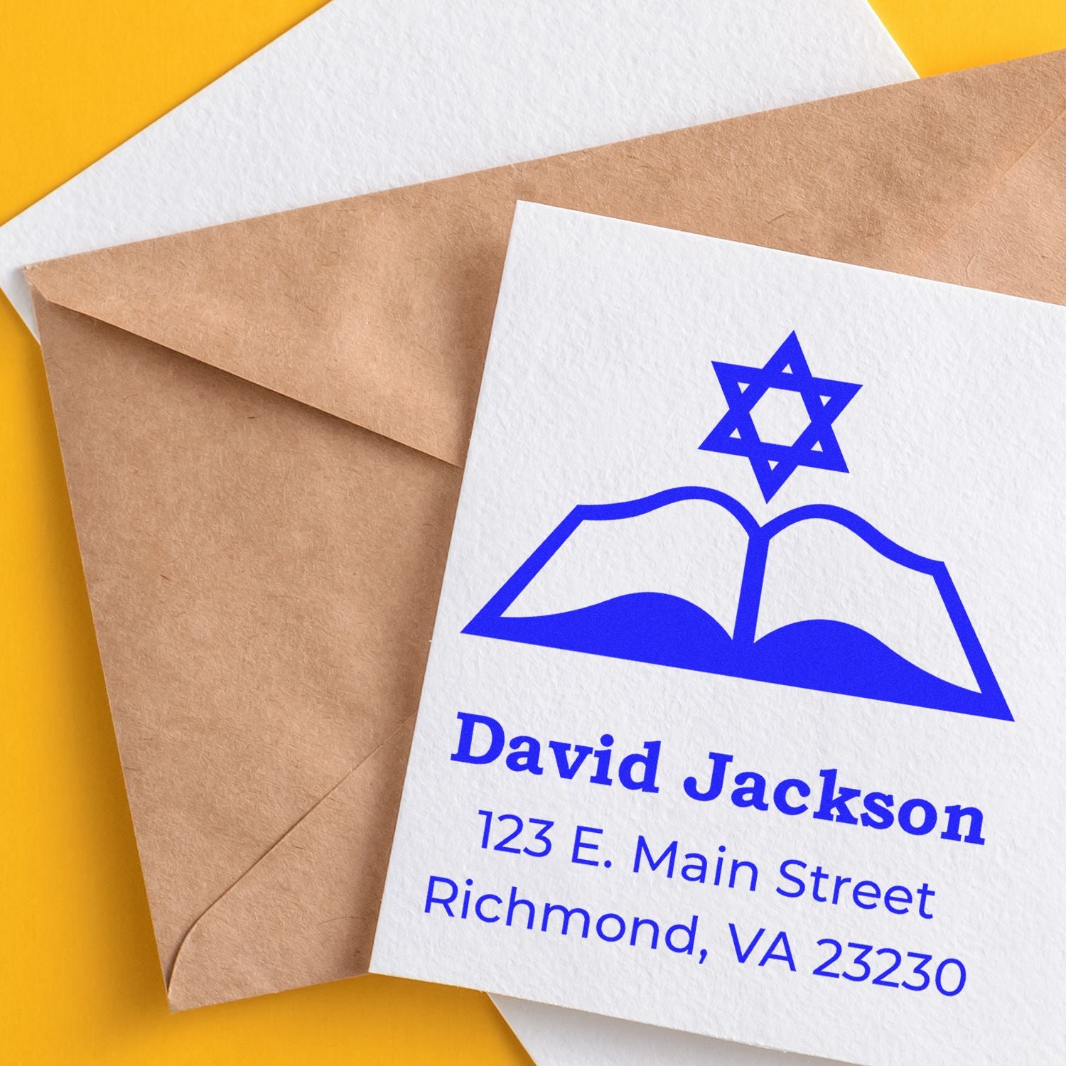 Custom return address rubber stamp with Star of David and book logo, printed on envelope for David Jackson in Richmond, VA.