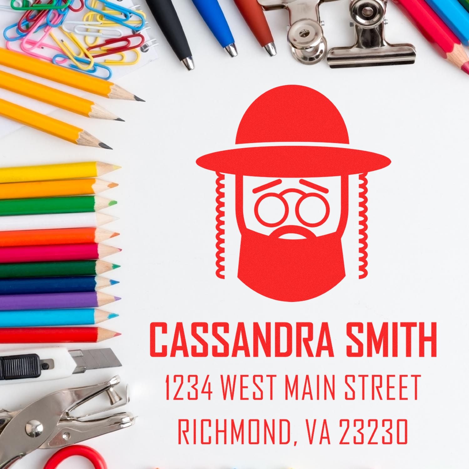 Personalized rubber stamp design for Cassandra Smith with Richmond, VA address, shown with stationery supplies.