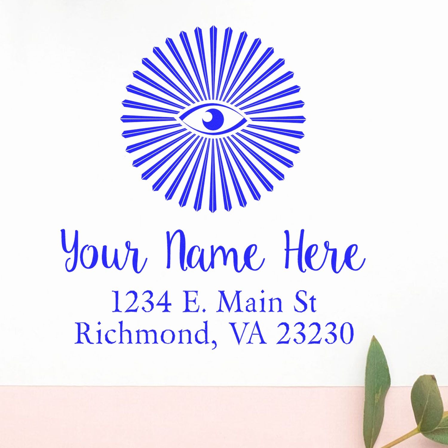Personalized rubber address stamp with eye logo and return address: Your Name Here, 1234 E. Main St, Richmond, VA 23230