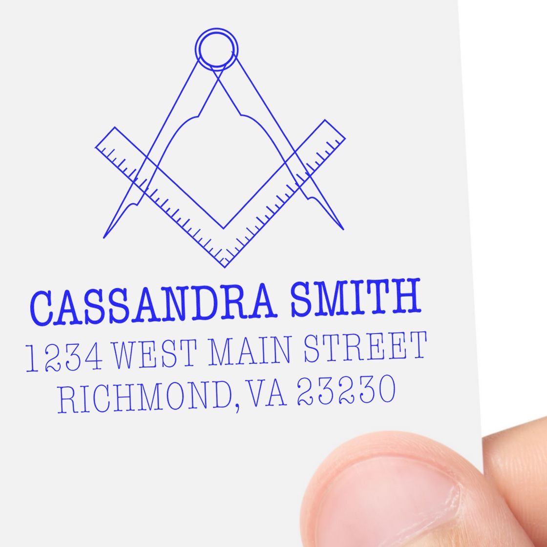 Custom rubber address stamp with compass and ruler design for Cassandra Smith, 1234 West Main Street, Richmond, VA 23230.