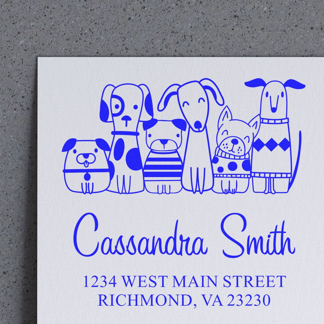 Personalized rubber stamp with dog illustration, Cassandra Smith name, and Richmond, VA return address in blue ink.