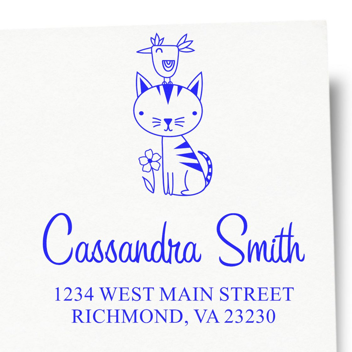 Custom return address rubber stamp with cat and bird illustration, Cassandra Smith, 1234 West Main Street, Richmond, VA 23230.