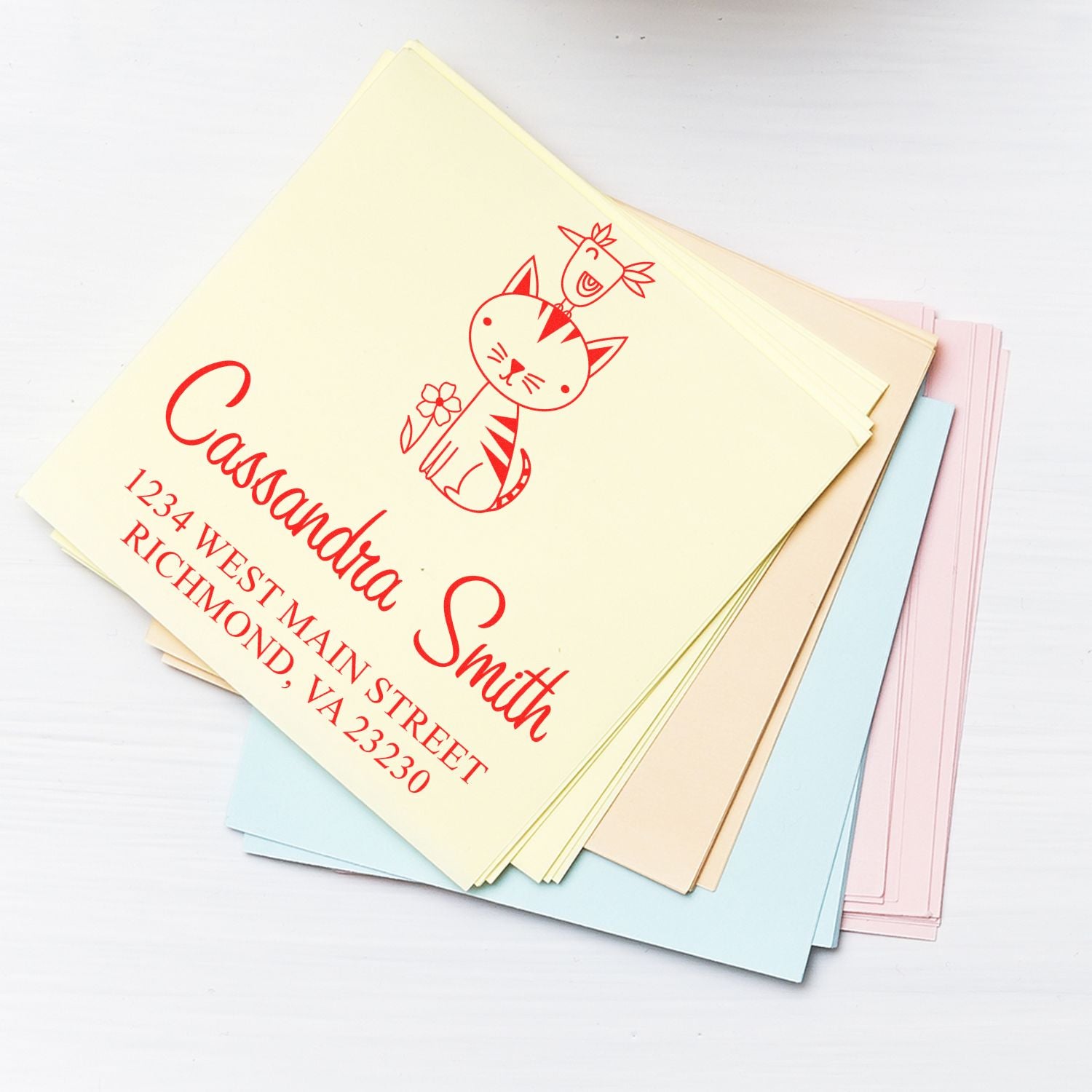 Custom return address rubber stamp with cat design for personalized envelopes and stationery.