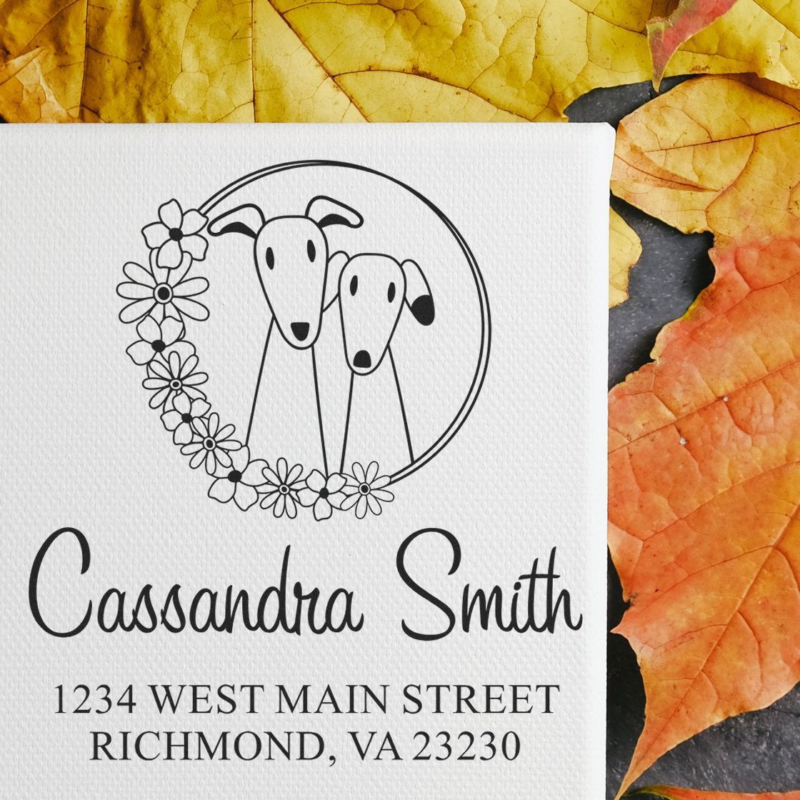 Custom two-dog address rubber stamp with floral wreath and personalized return address for stationery and invitations.