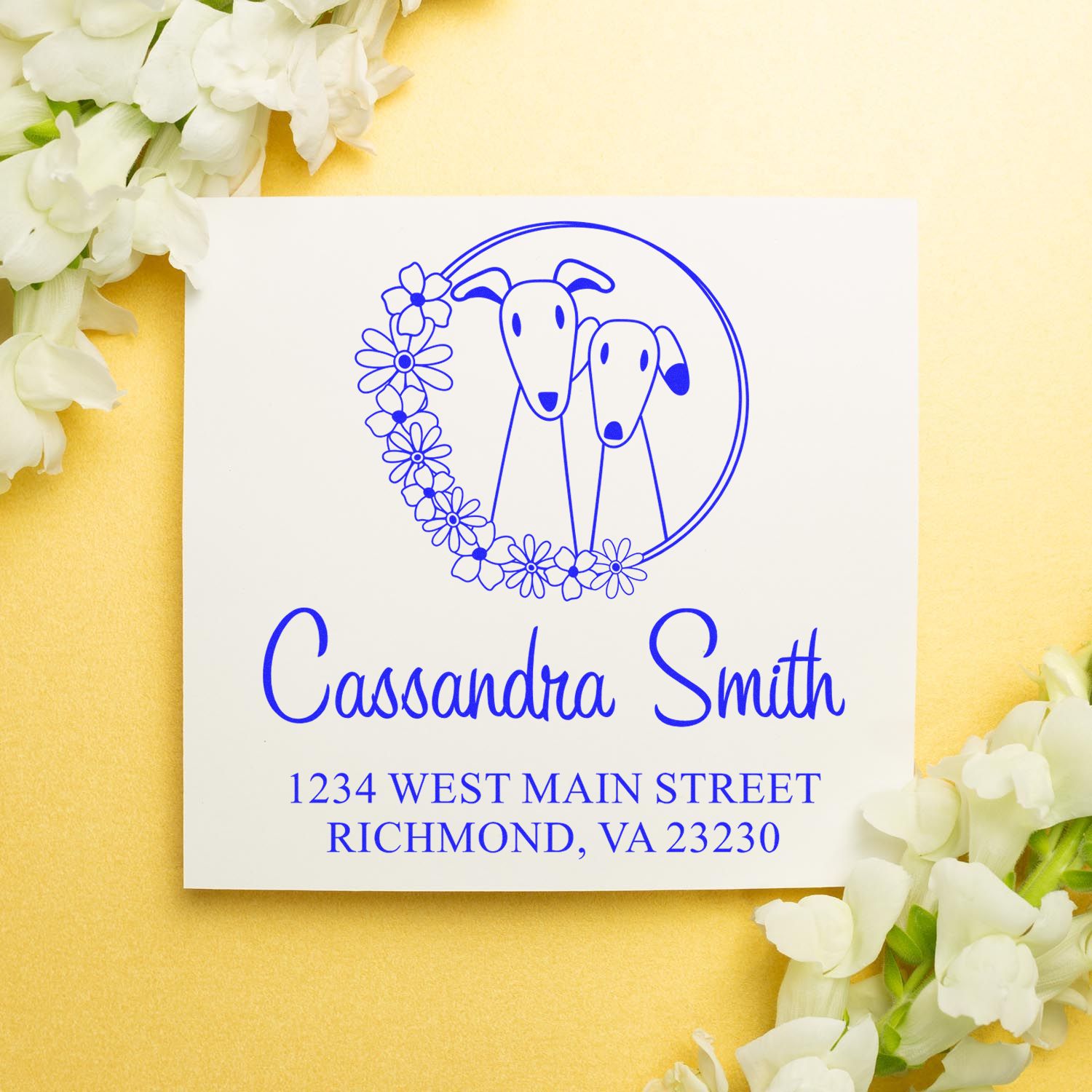 Personalized dog-themed return address rubber stamp with floral wreath, custom name, and mailing address.