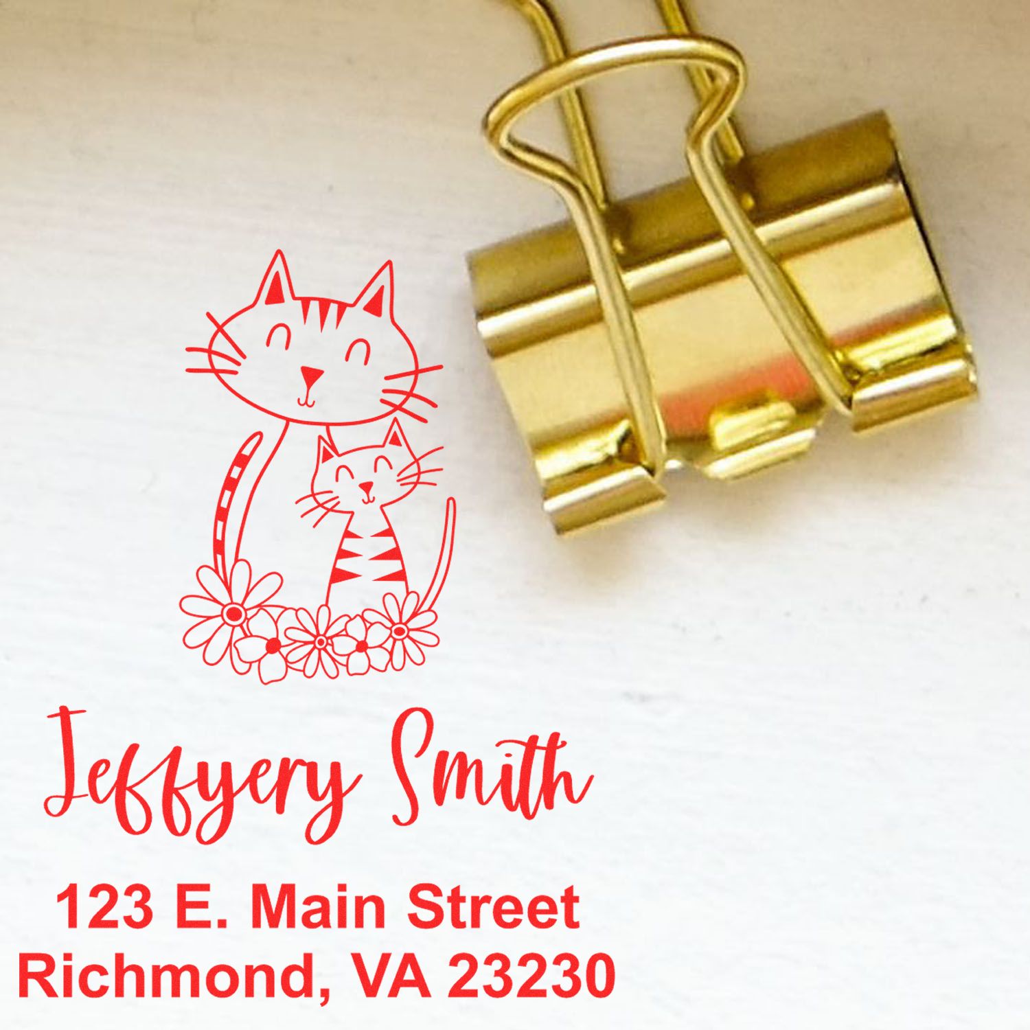 Custom cat logo rubber stamp with name and address for branding, return mail, and business correspondence.