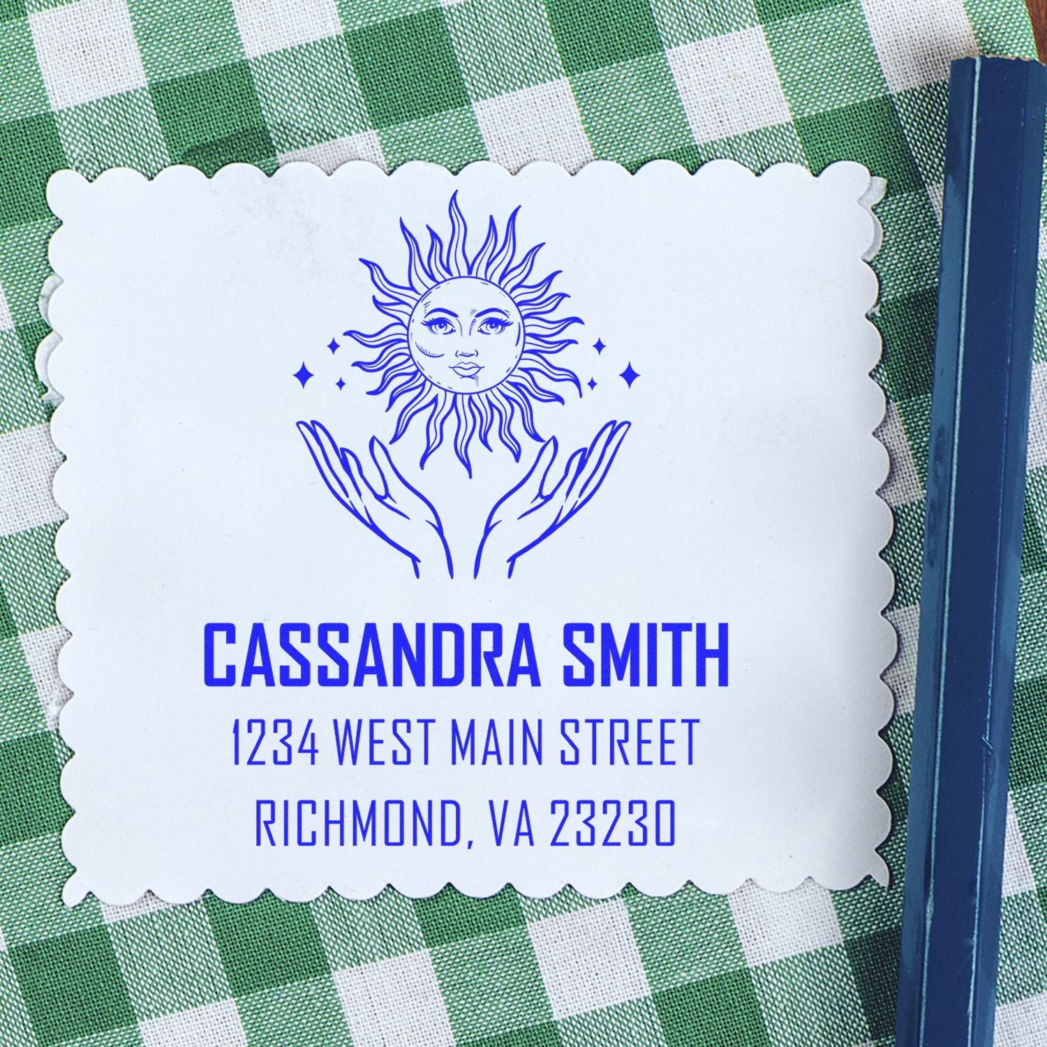 Custom return address rubber stamp with sun-and-hands design for Cassandra Smith, Richmond, VA