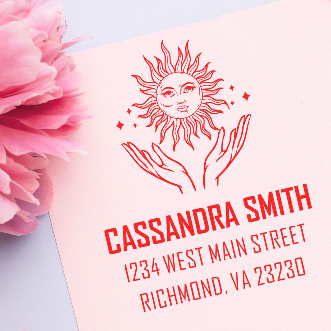 Custom rubber stamp design with sun and hands logo, personalized return address for Cassandra Smith in Richmond, VA.