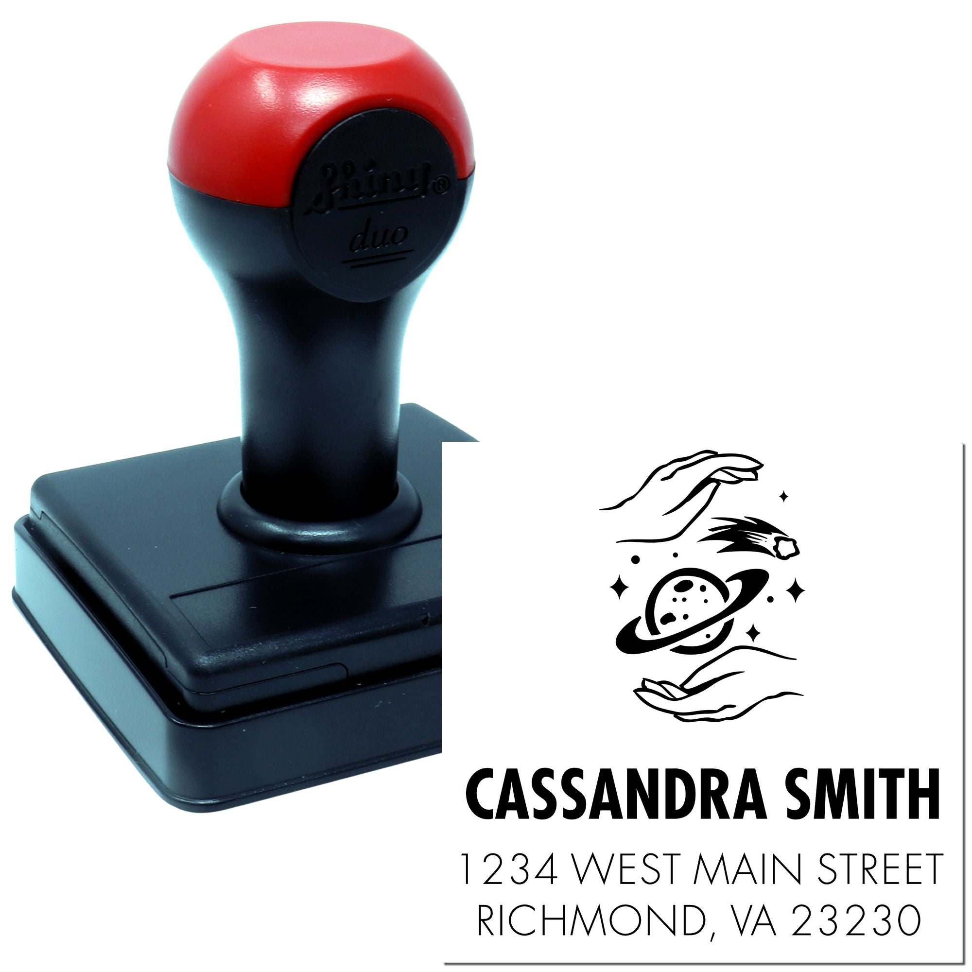 Custom self-inking rubber address stamp with space-themed design, showing sample imprint for Cassandra Smith, Richmond, VA.