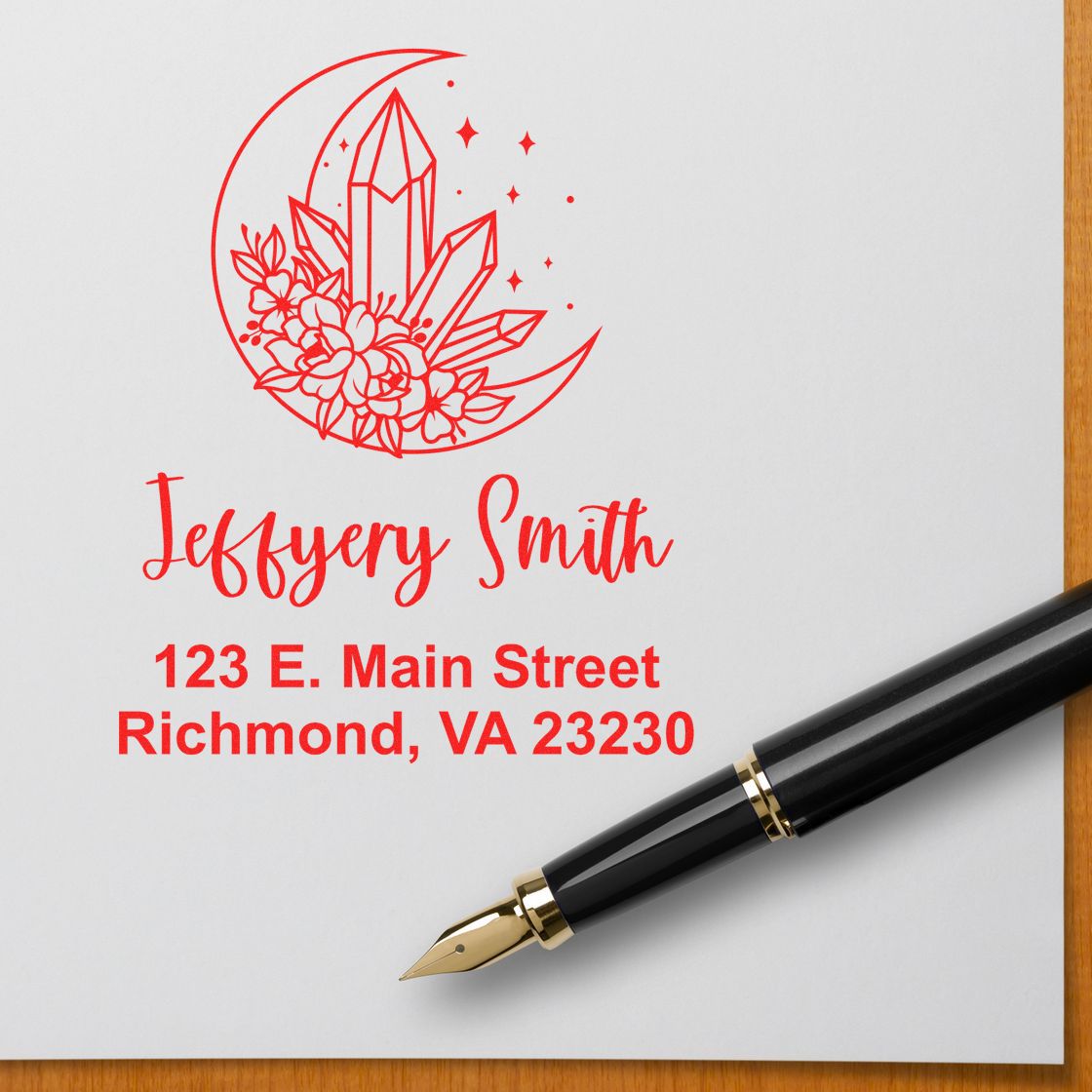 Custom return address rubber stamp with crescent moon, crystal floral design, name, and Richmond, VA address.