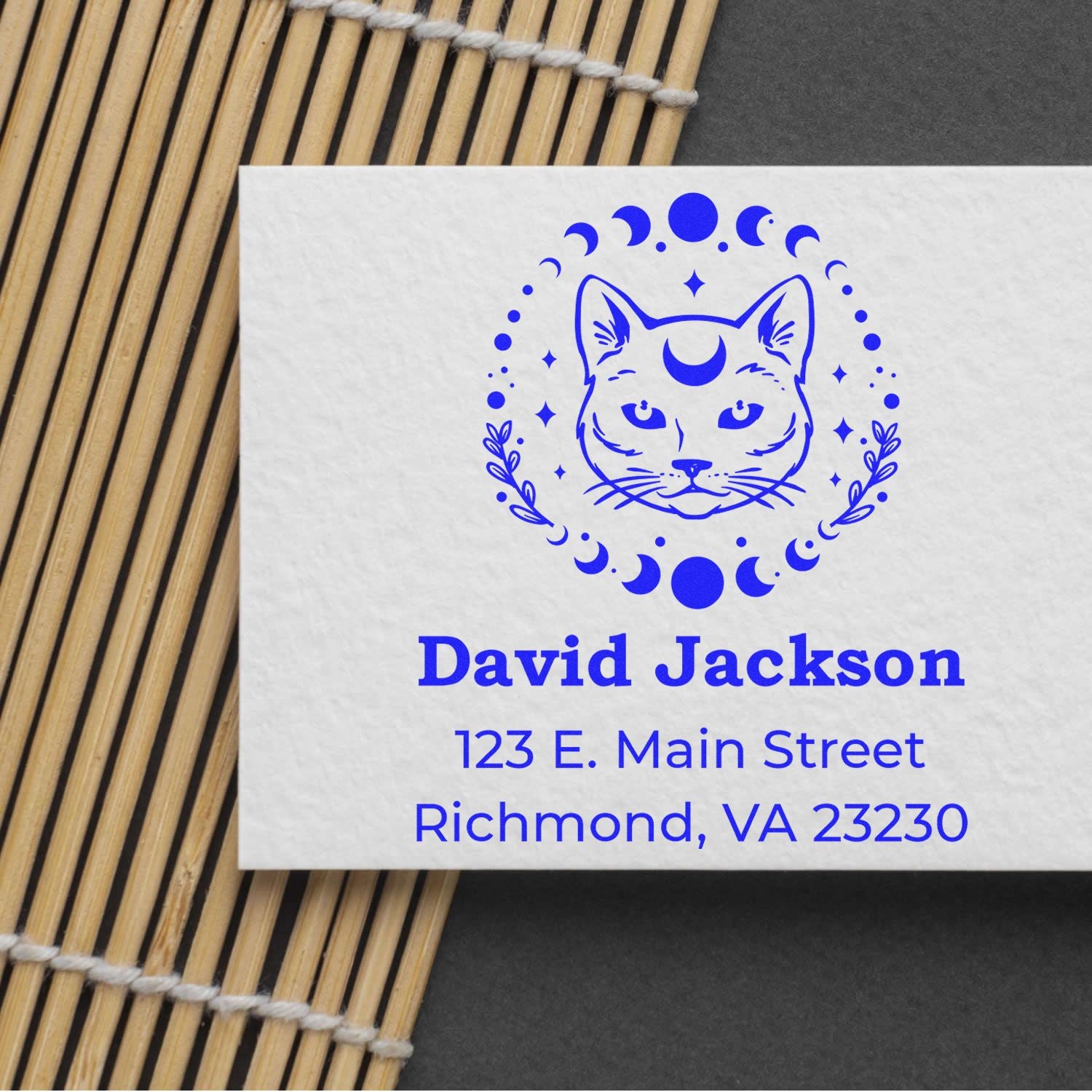 Custom pet business address rubber stamp with cat logo, name David Jackson, and Richmond, VA address in blue ink.