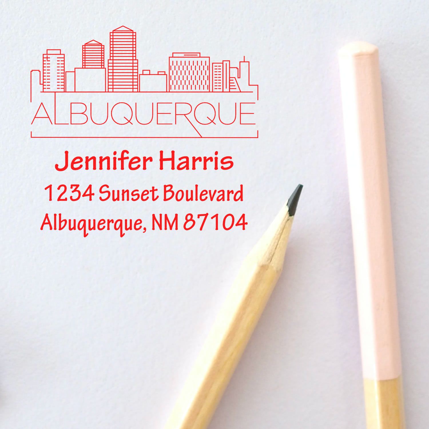 Custom Albuquerque skyline rubber stamp with Jennifer Harris return address, 1234 Sunset Boulevard, Albuquerque, NM 87104.