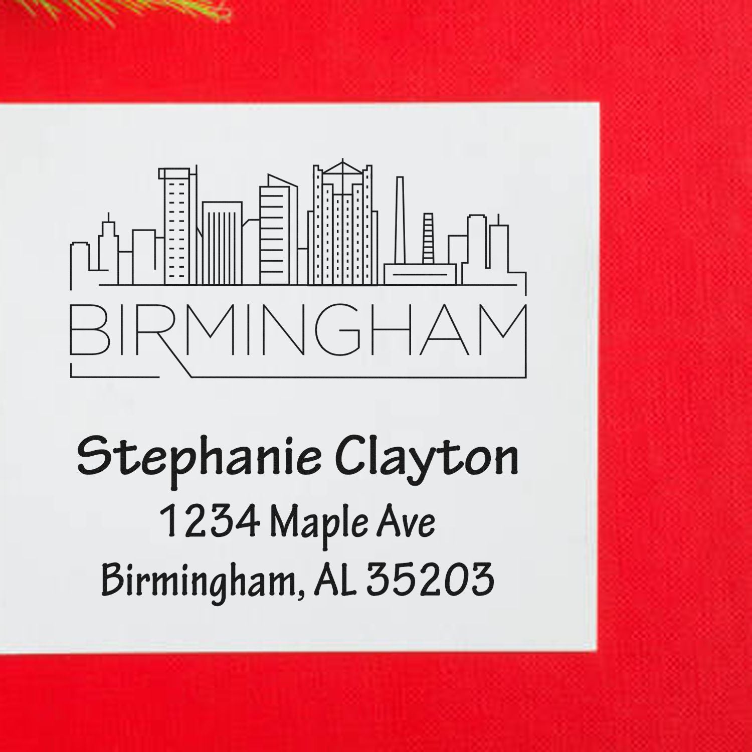 Custom Birmingham address rubber stamp with skyline, featuring Stephanie Clayton, 1234 Maple Ave, Birmingham, AL 35203.