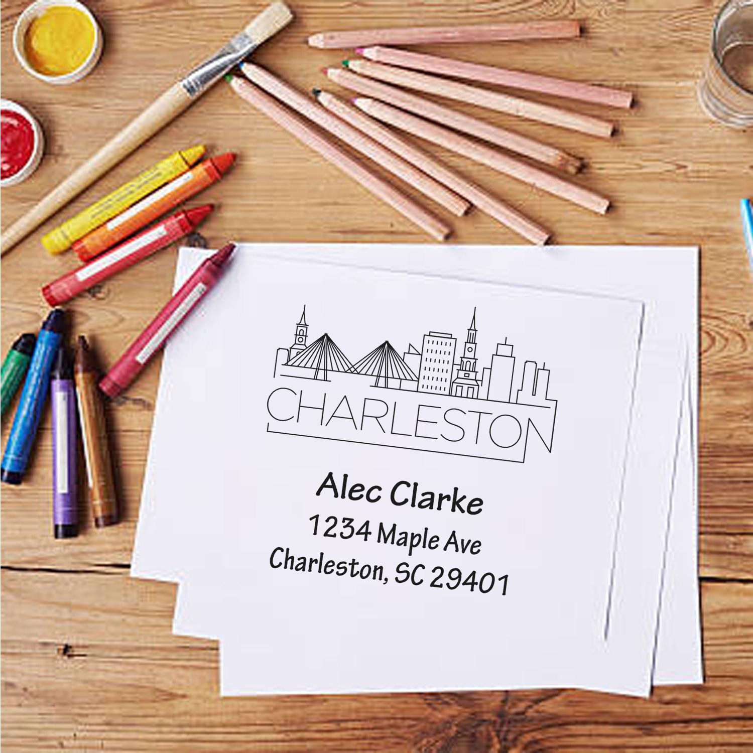 Custom rubber address stamp with Charleston skyline, name and address for personalized mail and stationery.