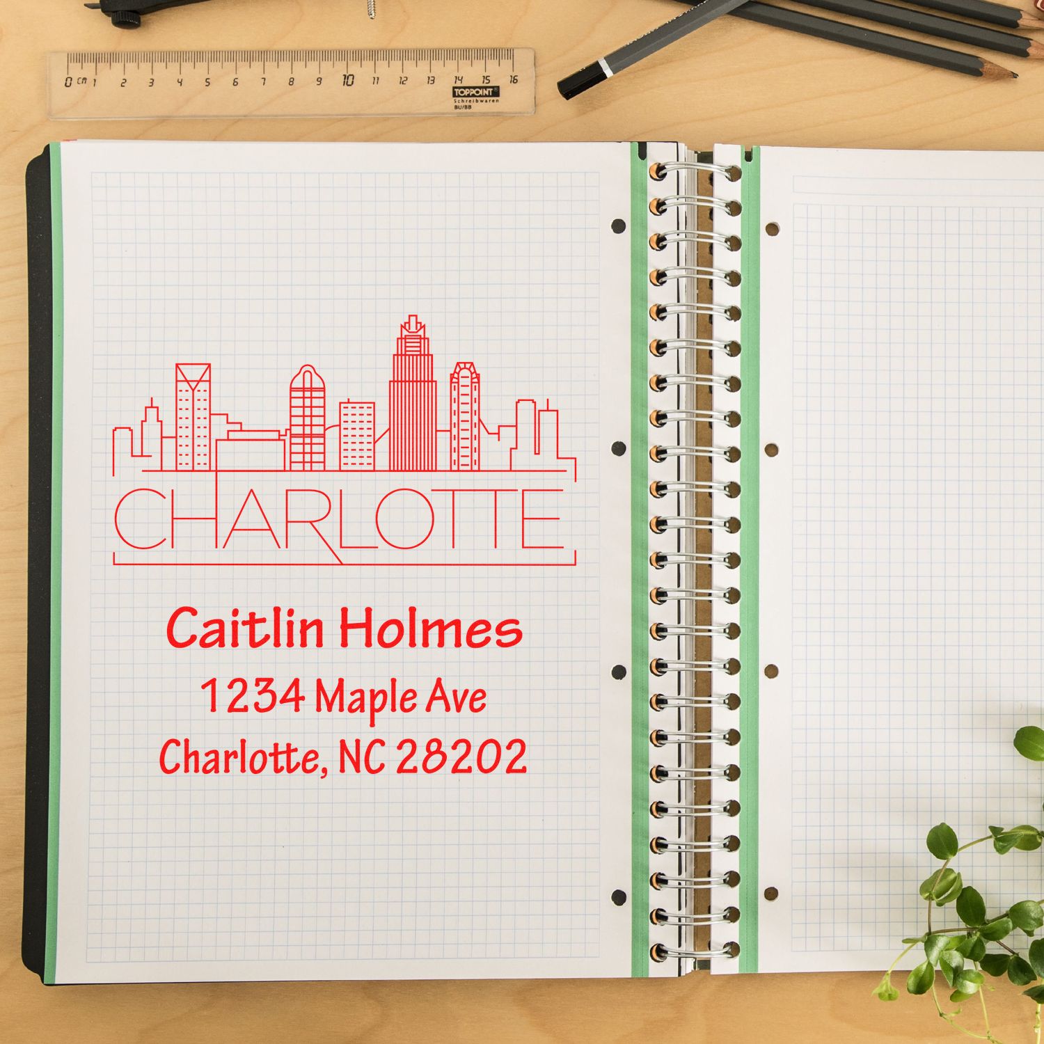 Personalized Charlotte address rubber stamp with skyline design, featuring Caitlin Holmes and 1234 Maple Ave, Charlotte, NC 28202