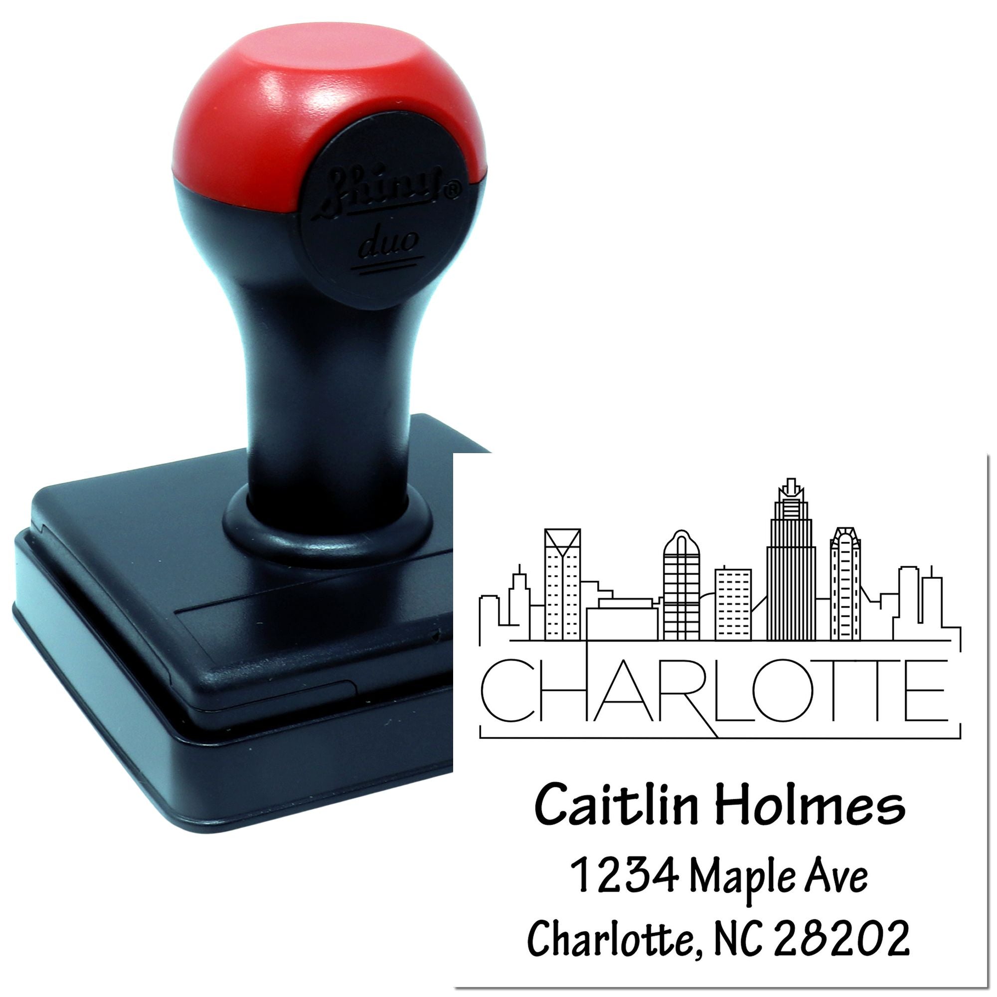 Custom self-inking address rubber stamp with Charlotte skyline design and personalized name and mailing address.