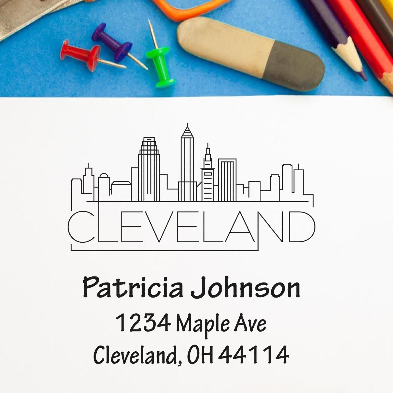 Custom Cleveland skyline return address rubber stamp with personalized name and address for envelopes and business mail.