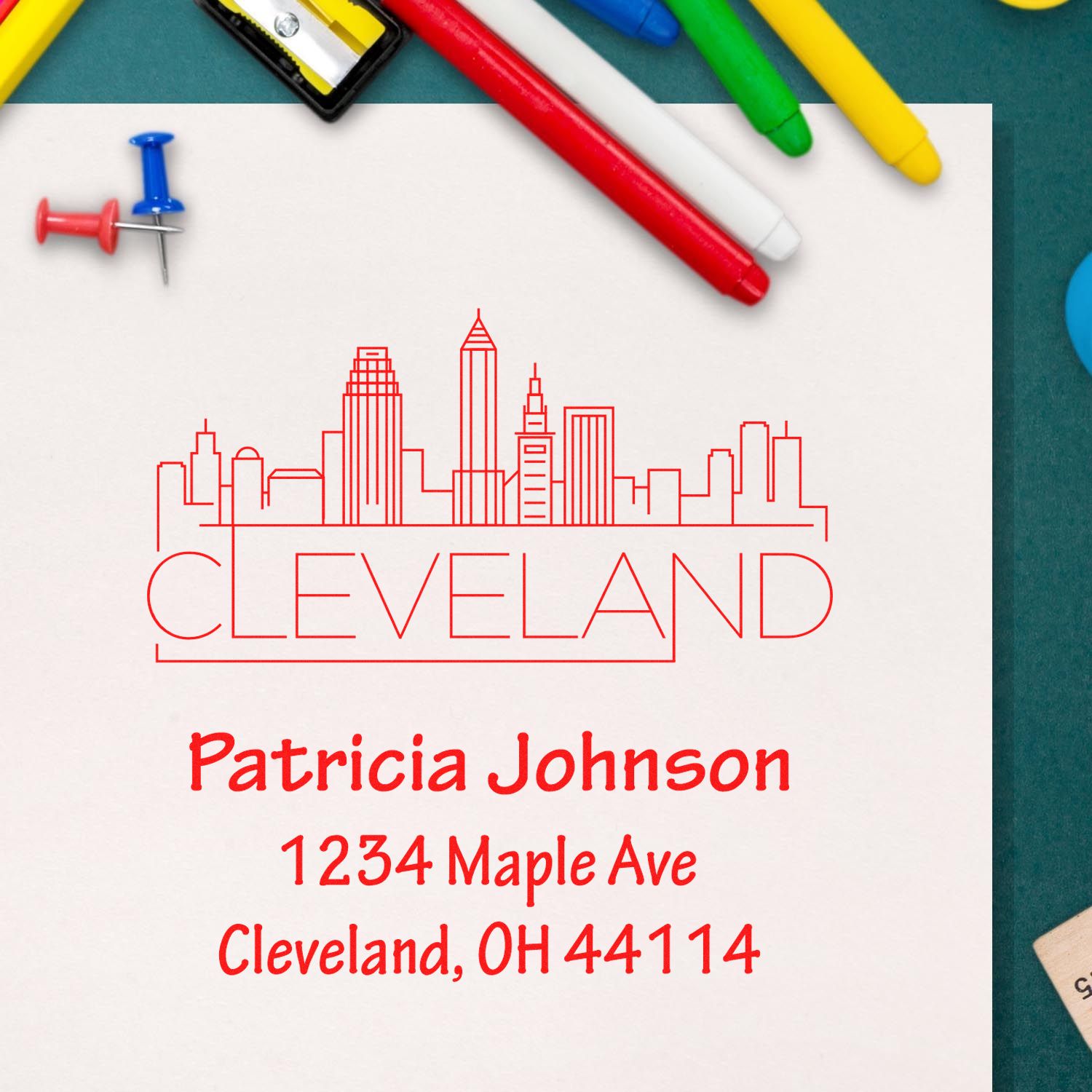 Custom Cleveland return address rubber stamp with skyline, personalized for Patricia Johnson, 1234 Maple Ave, OH 44114.