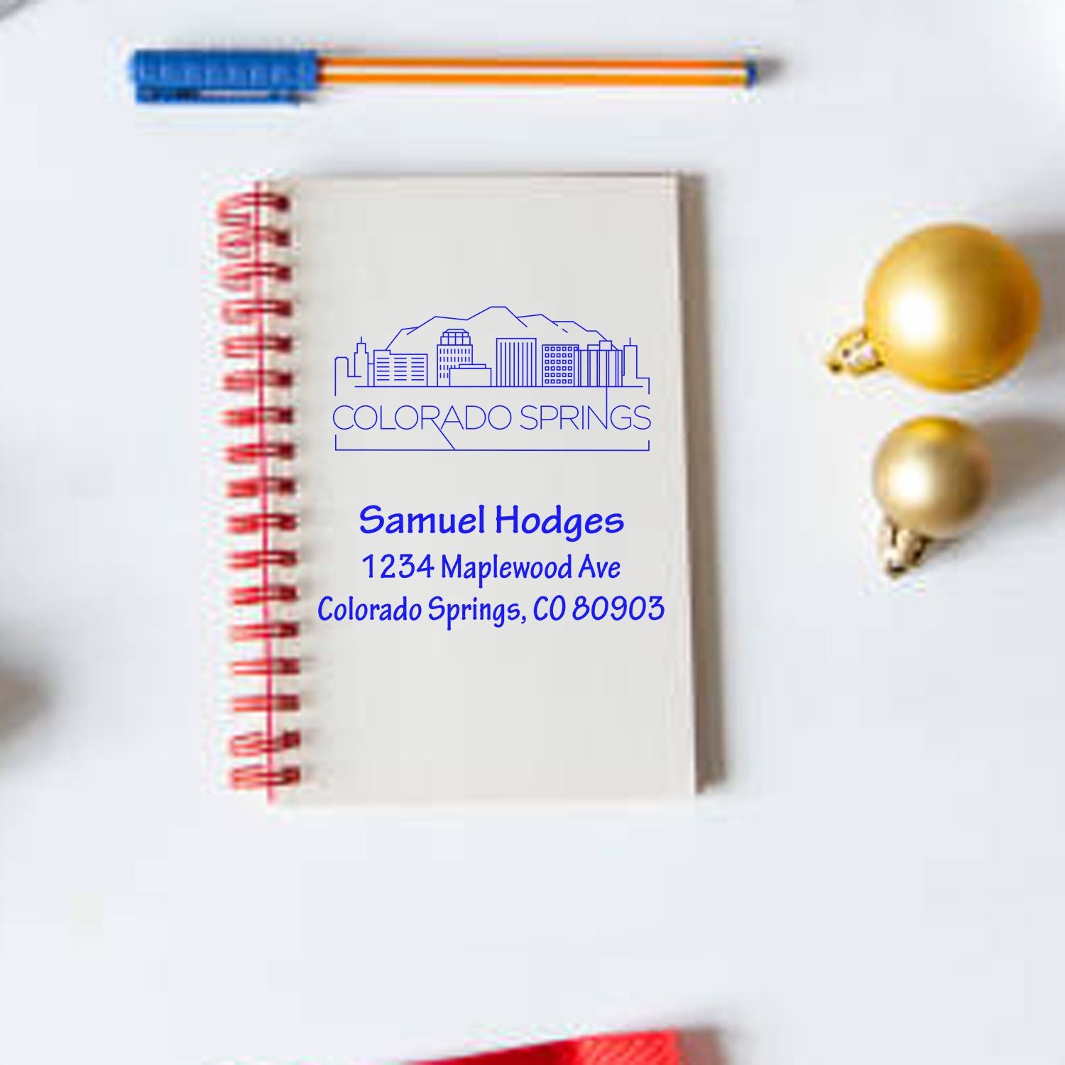 Custom Colorado Springs return address rubber stamp with skyline design and personalized name for stationery and mailing.
