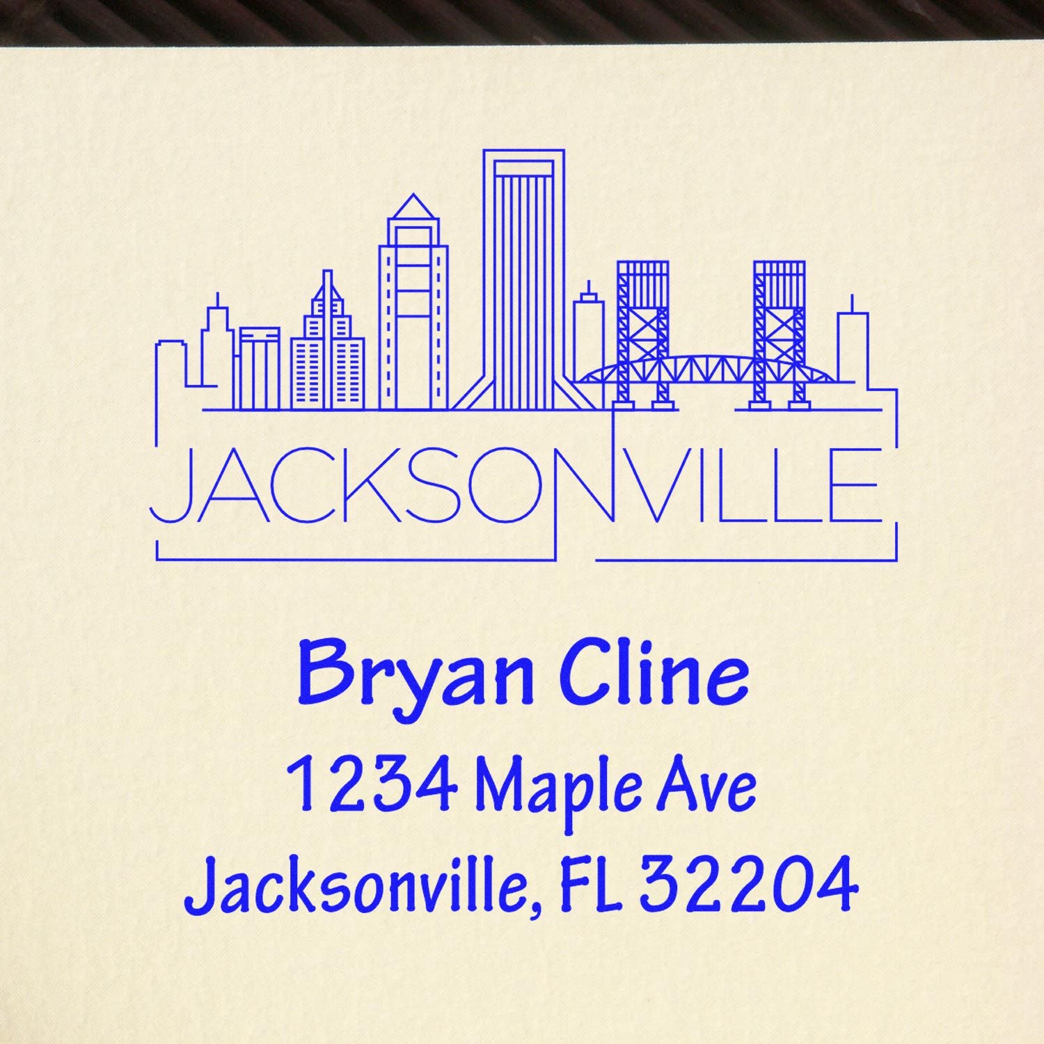 Custom Jacksonville address rubber stamp with skyline design, Bryan Cline name, and 1234 Maple Ave, FL 32204.